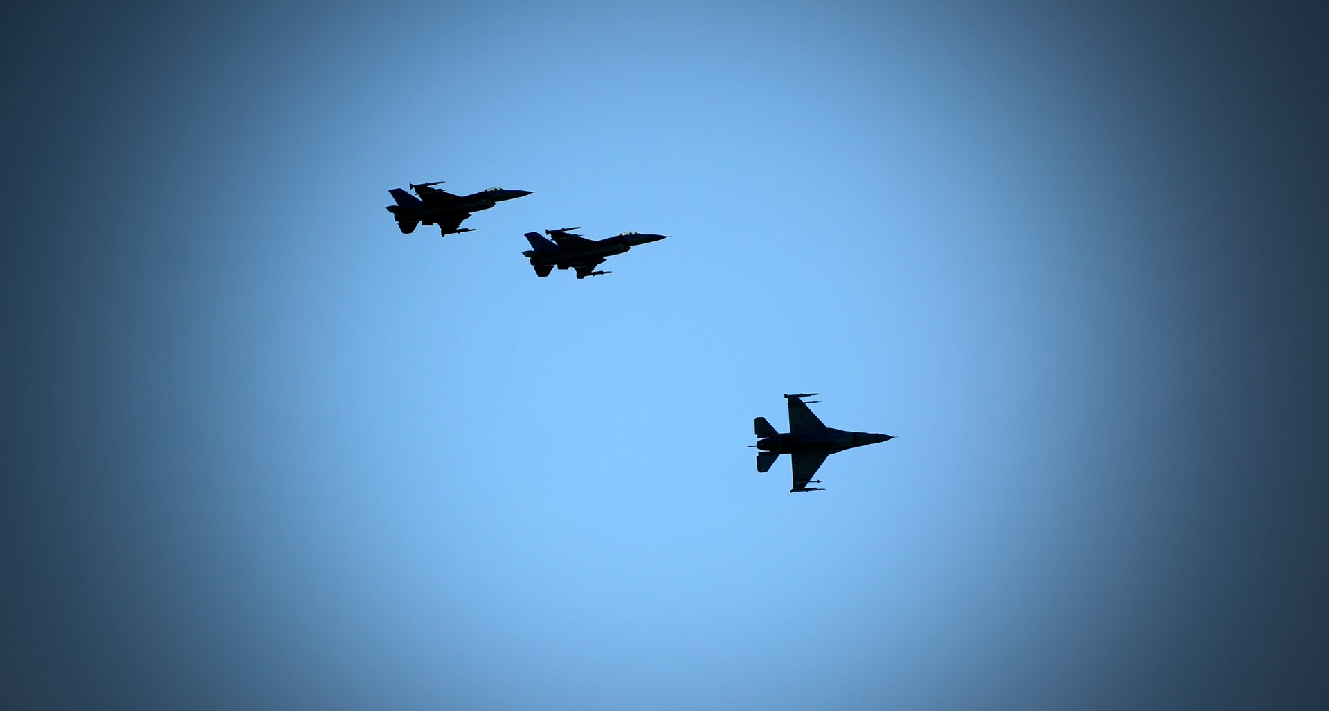 Three F-16 Fighting Falcons from the 35th Fighter Squadron fly over Kunsan Air Base during Exercise Buddy Wing 15-4, June 3, 2015. In an effort to enhance U.S. and ROKAF combat capability, Buddy Wing exercises are conducted multiple times throughout the year on the peninsula to sharpen interoperability between the allied forces so that if need be, they are always ready to fight as a combined force. (U.S. Air Force photo by Staff Sgt. Nick Wilson/Released)