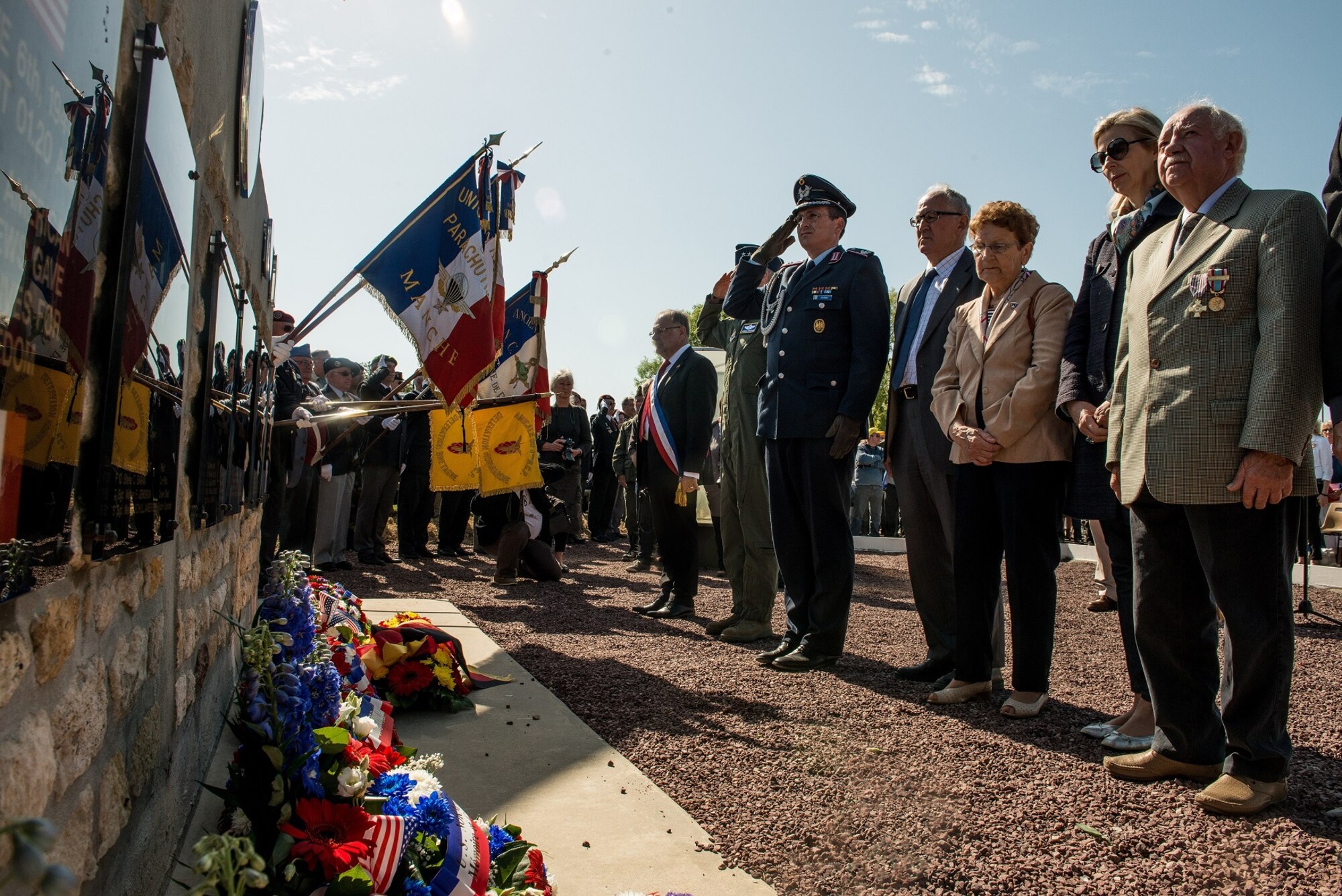 Allied leaders salute the memorial of fallen U.S. service members at the Picauville 9th Air Force monument June 4, 2015, Normandy, France. More than 380 servicemembers from Europe and affiliated D-Day historical units are participating in the 71st Anniversary as part of Joint Task Force D-Day 71. The task force, based in Saint Mere Eglise, France, is supporting local events across Normandy, from 2-8 June, 2015 to commemorate the selfless actions by all the Allies on D-Day that continue to resonate 71 years later. (U.S. Air Force photo/Senior Airman Nicole Sikorski)