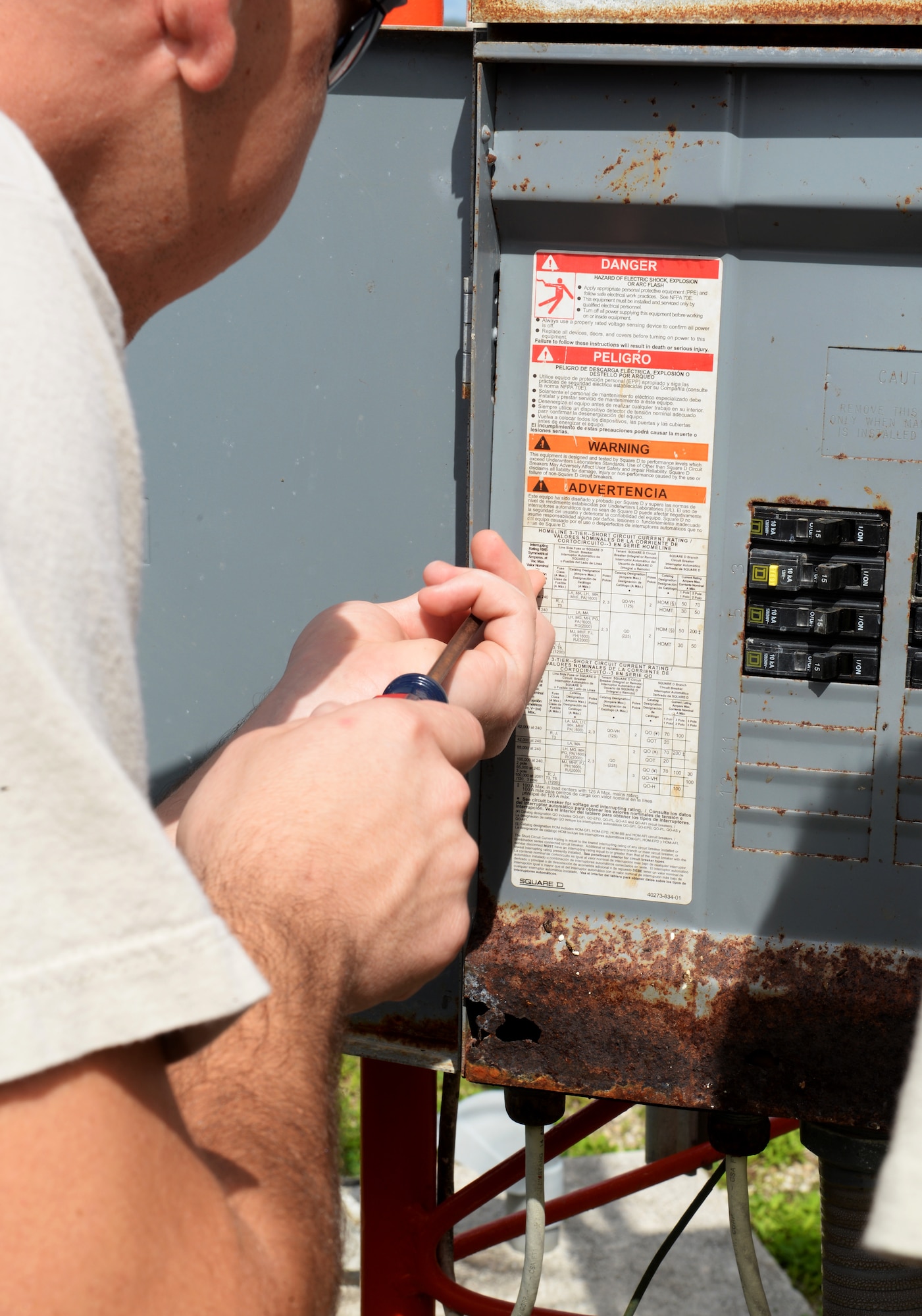 Senior Airman Patrick Duffie, 36th Operations Support Squadron airfield systems technician, opens a power panel to ensure the breaker is performing properly June 2, 2015, at Andersen Air Force Base, Guam. The technicians guarantee safe landings everyday by performing routine checks on essential equipment such as the glideslope, localizer, and TACAN or tactical air navigation. (U.S. Air Force photo by Senior Airman Amanda Morris/Released)