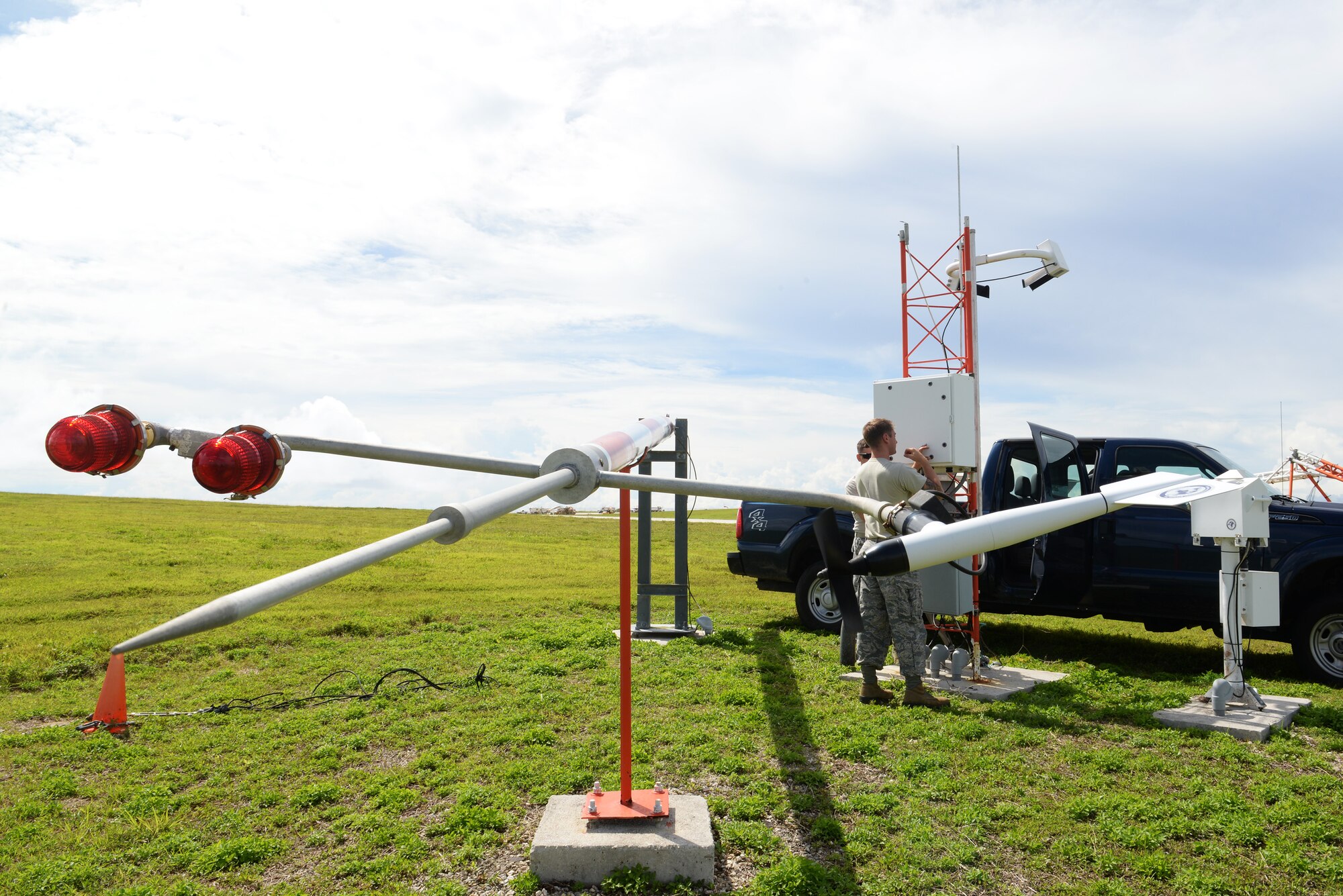 Airfield systems Airmen from the 36th Operations Support Squadron open a field data collection unit June 2, 2015, at Andersen Air Force Base, Guam. The technicians check circuits within the unit for arch burns, blown fuses, loose wires and missing parts to ensure life-saving equipment is operational at all times. (U.S. Air Force photo by Senior Airman Amanda Morris/Released)