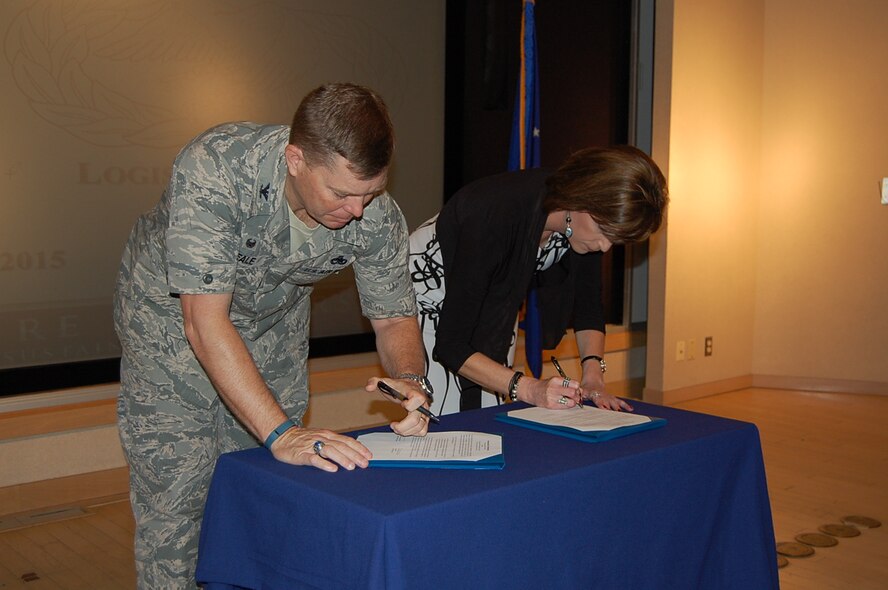Col. Clayton Seale, 82nd Training Group commander, and Lynn Arias, Logistics Officer Association National Chief Information Officer, sign a strategic partnership between the LOA and the Air Force Logistics Officers Schoolhouse at Sheppard Air Force Base, Texas, May 21, 2015. (Courtesy photo) 