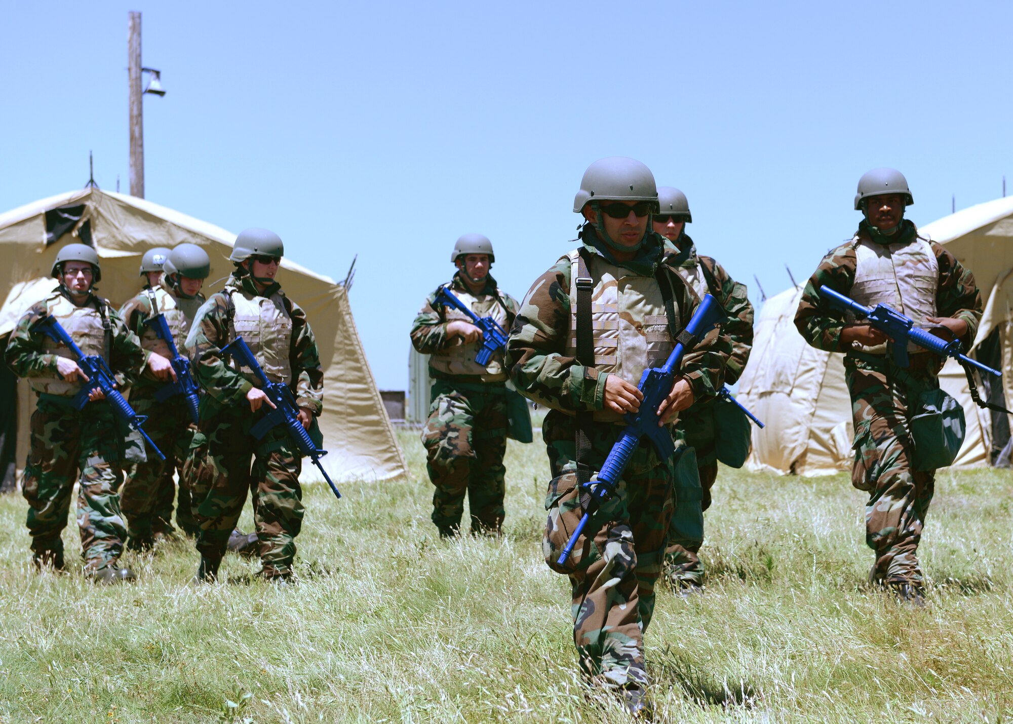 U.S. Air Force contracting Airmen prepare to go on a patrol during a joint bare-base exercise at Altus Air Force Base, Oklahoma, June 3, 2015. Airmen from Altus Air Force Base and Sheppard Air Force Base, Texas participated in a joint contingency contracting bare-base exercise in order to provide training to younger Airmen who have not yet to be deployed. (U.S. Air Force photo by Airman 1st Class Nathan Clark)