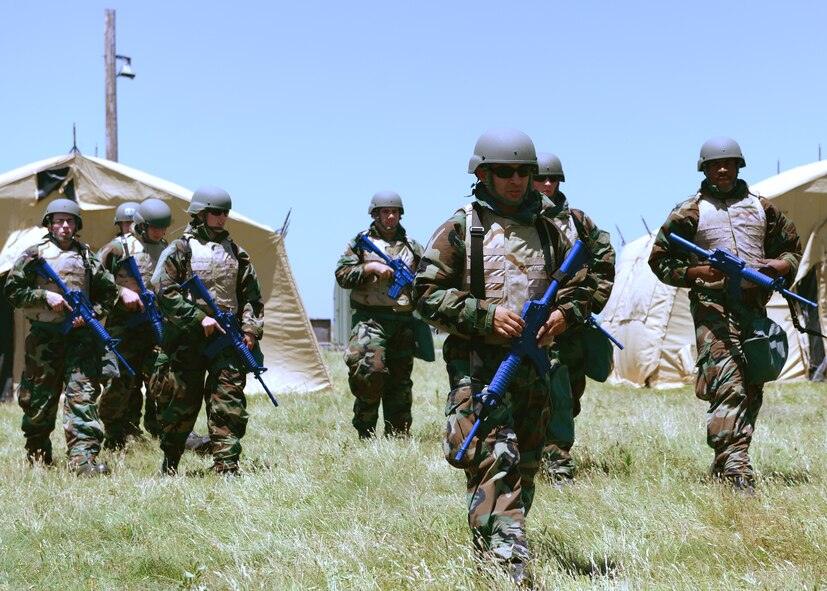 U.S. Air Force contracting Airmen prepare to go on a patrol during a joint bare-base exercise at Altus Air Force Base, Oklahoma, June 3, 2015. Airmen from Altus Air Force Base and Sheppard Air Force Base, Texas participated in a joint contingency contracting bare-base exercise in order to provide training to younger Airmen who have not yet to be deployed. (U.S. Air Force photo by Airman 1st Class Nathan Clark)