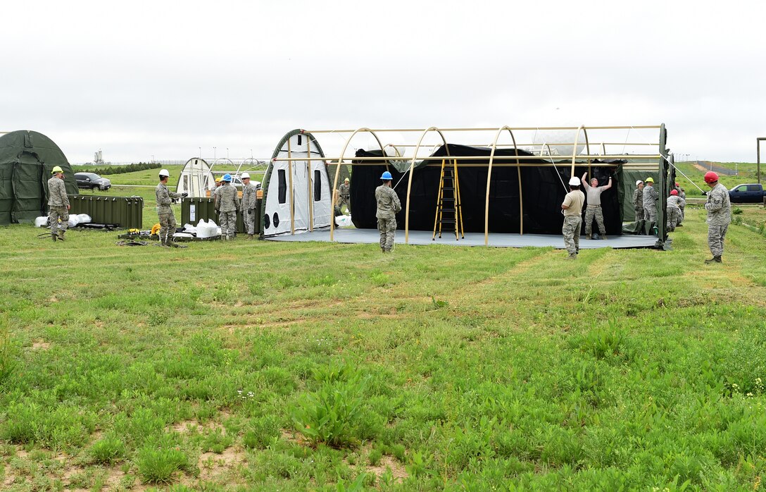 The 460th Civil Engineer Squadron constructed a tent city for incoming Combat Logistics Battalion-453 Marine Reserves who are completing their annual training June 3, 2015 on Buckley Air Force Base, Colo. The tent city, which included 10 tents, complete with electrical and air conditioning, took the 460th CES 11 hours to complete. Every shop had a hand in the construction and set up of the tents. (U.S. Air Force photo by Airman 1st Class Luke W. Nowakowski/Released)