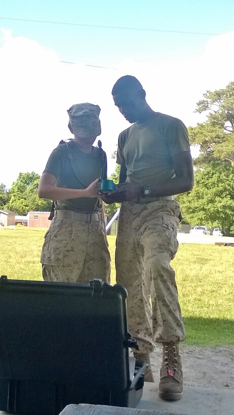 Marines from BWST 6-15 conduct a performance test on Water Quality Analysis Set-Purification.