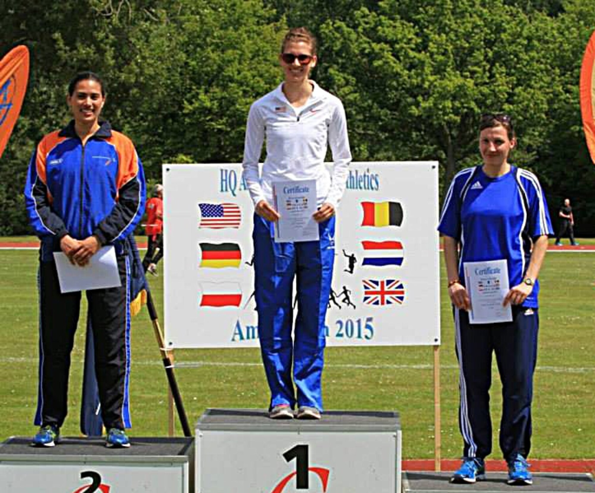 Second Lt. Rachel Herald, 90th Logistics Readiness Squadron installation deployment officer at F.E. Warren Air Force Base, Wyo., stands on the first-place pedestal for the top-three female high jumpers at the Headquarters AIRCOM Track and Field Championship held recently. Herald applied to be part of the U.S. Air Forces in Europe team that took part in the competition against Airmen from multiple European countries. (Courtesy photo)