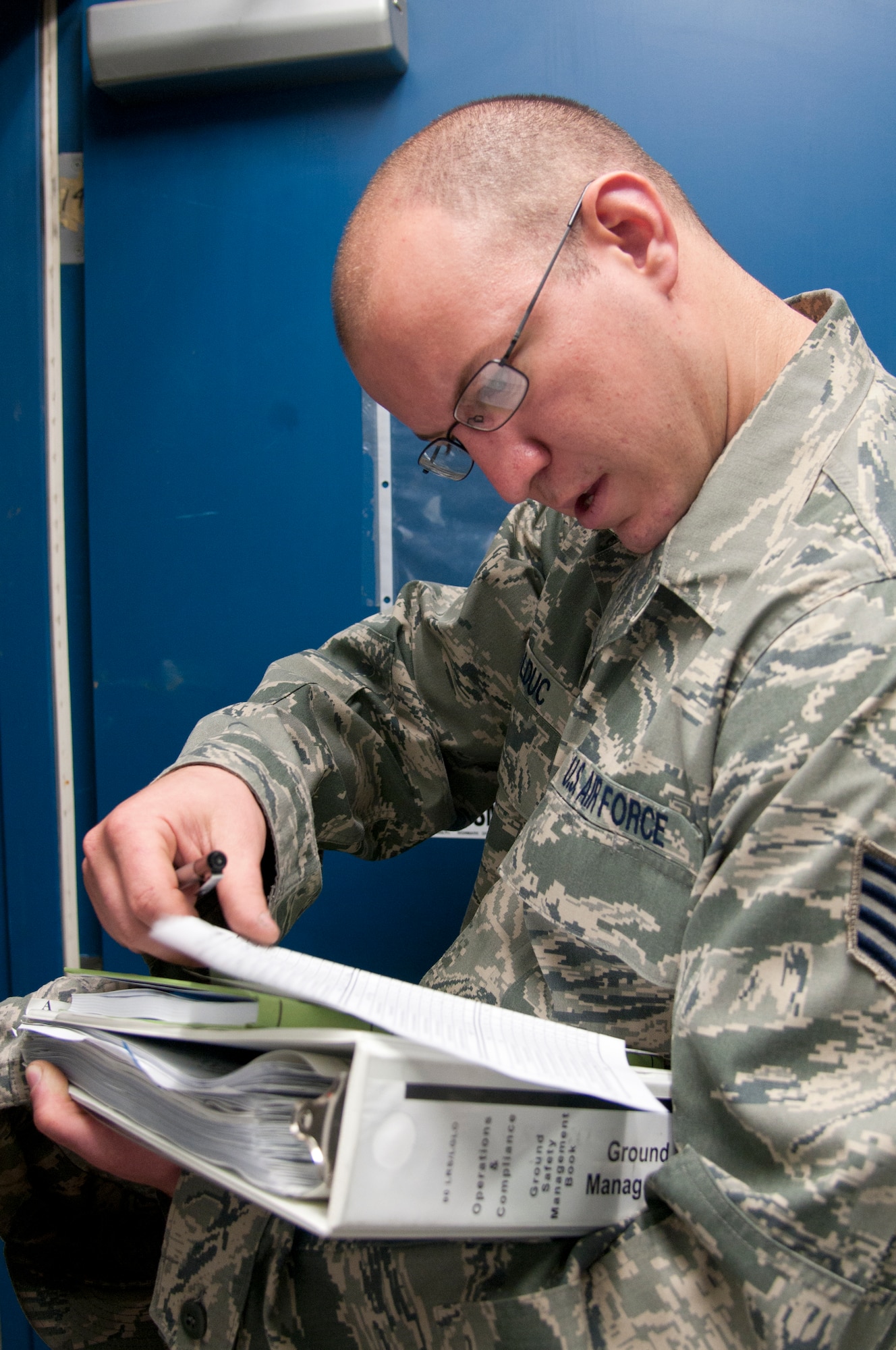 Staff Sgt. Philip Bolduc, 90th Logistics Readiness Squadron vehicle maintenance customer service NCOIC and safety representative, reviews his notes in the vehicle maintenance building June 4, 2014, during the squadron’s annual safety inspection. This was Bolduc’s first safety inspection as the safety representative. (U.S. Air Force photo by Airman 1st Class Malcolm Mayfield)