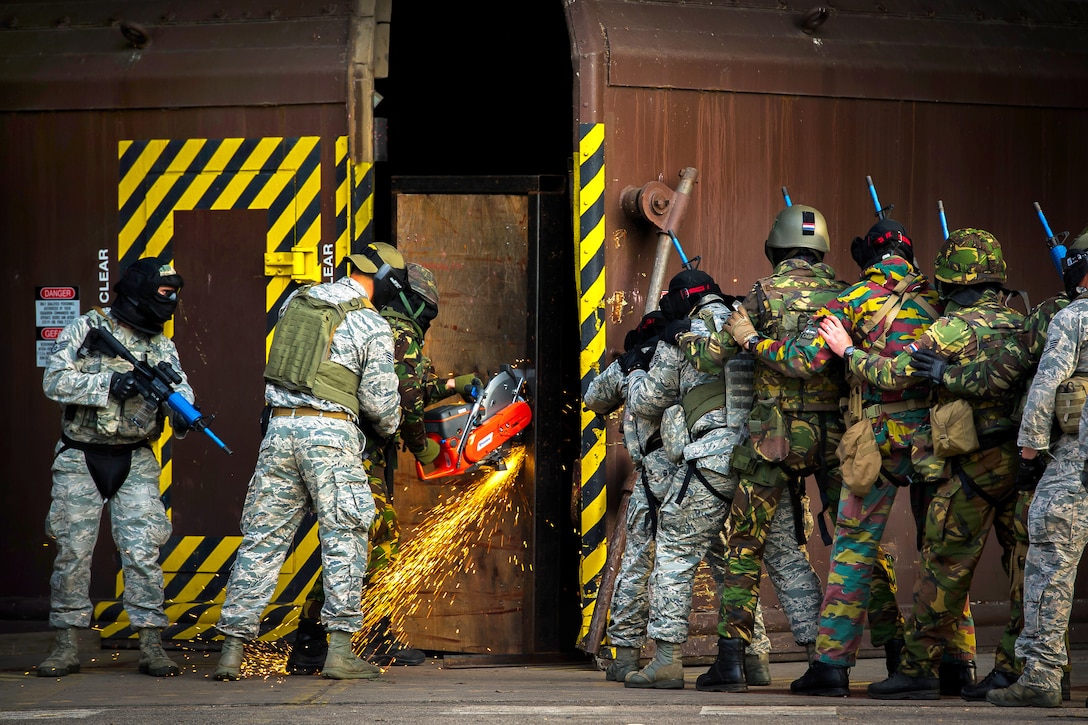 U.S. and NATO troops breach a hardened facility during a combat training course on Ramstein Air Base, Germany, May 30, 2015.