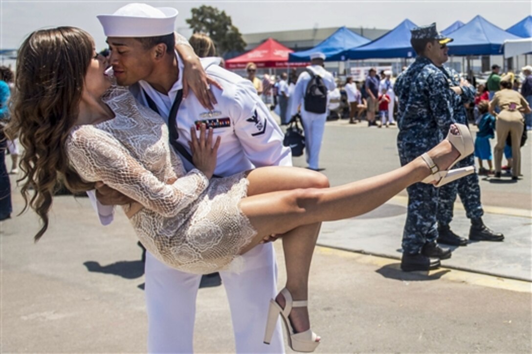 Navy Petty Officer 3rd Class Jesse Ibarra greets his wife during a homecoming celebration on Naval Base San Diego, June 4, 2015. Ibarra, a boatswain's mate, is assigned to the guided-missile cruiser USS Bunker Hill, which returned from almost a 10-month deployment.