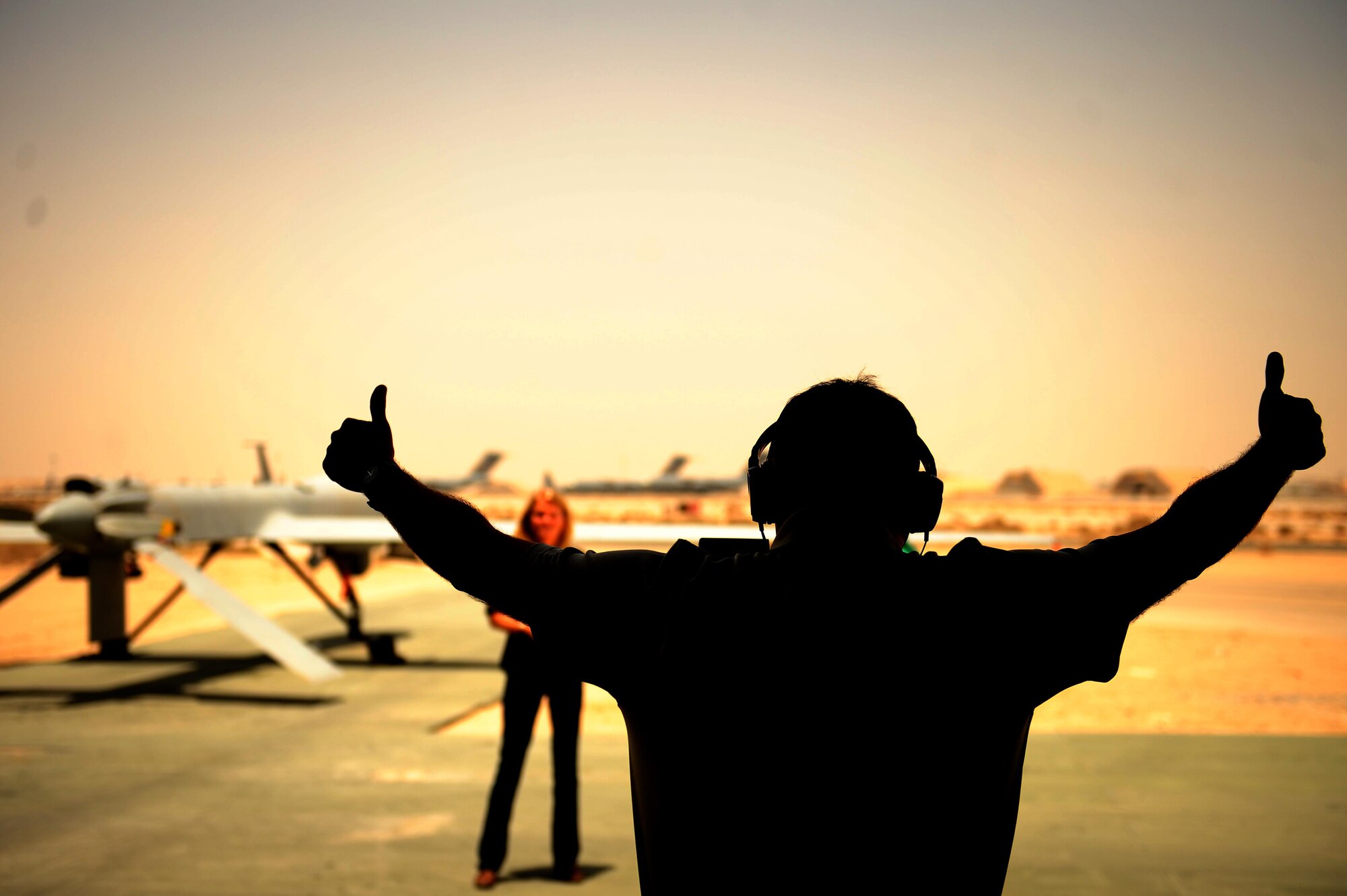Martha Raddatz, ABC News chief global affairs correspondent, films a news story about Remotely Piloted Aircraft and their role in Operation Inherent Resolve during a visit to an undisclosed location in Southwest Asia, June 6, 2015. The 386th Air Expeditionary Wing conducts precision strikes and persistent Intelligence, Surveillance and Reconnaissance (ISR) as part of the strategy to degrade and defeat the Islamic State of Iraq and Syria, or ISIS.  (U.S. Air Force photo by Tech. Sgt. Brittany E. Jones)