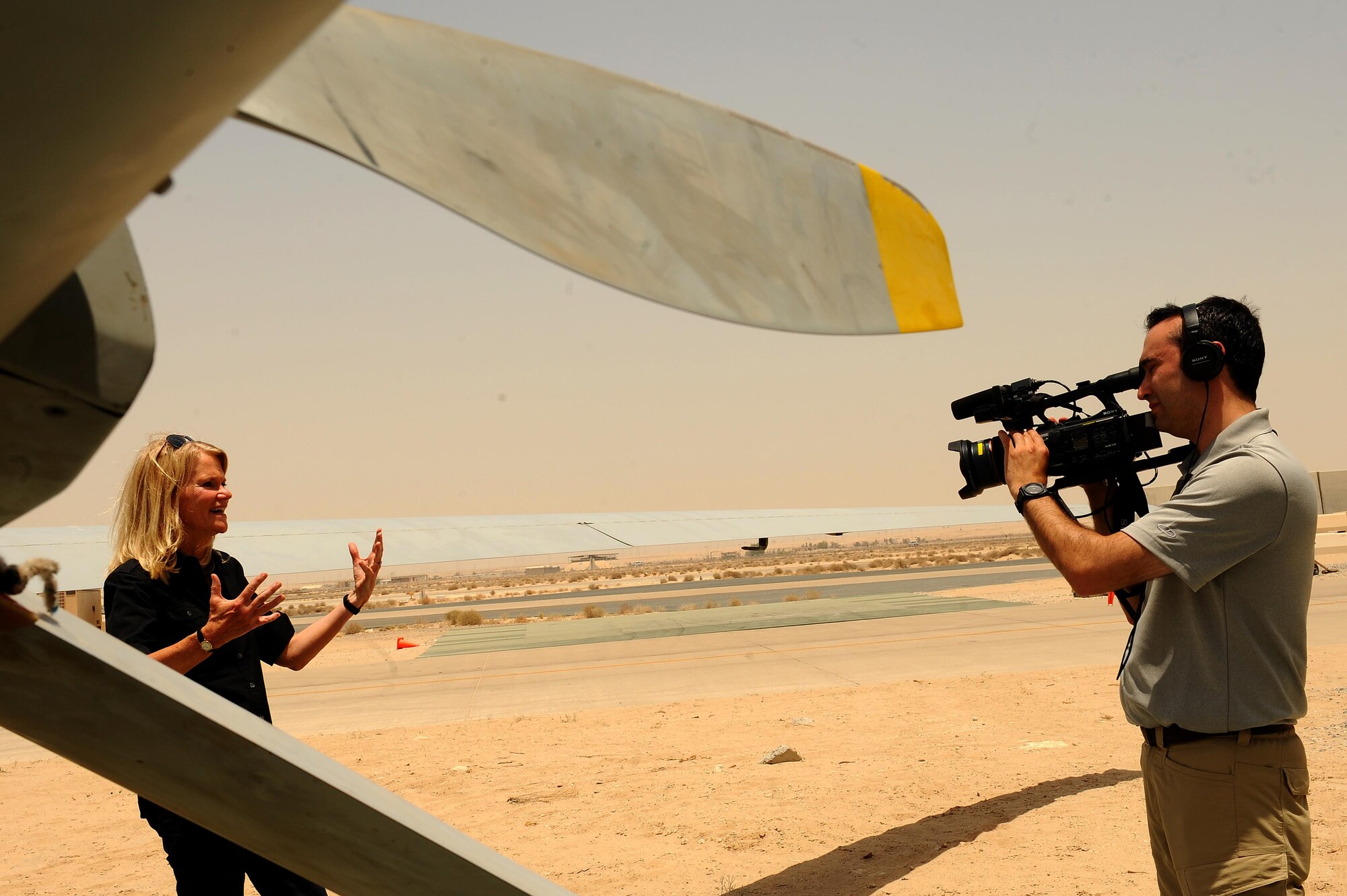 Martha Raddatz, ABC News chief global affairs correspondent, films a news story about Remotely Piloted Aircraft and their role in Operation Inherent Resolve during a visit to an undisclosed location in Southwest Asia, June 6, 2015. As of May 2015, 6,278 targets have been damaged or destroyed during OIR. (U.S. Air Force photo by Tech. Sgt. Brittany E. Jones)