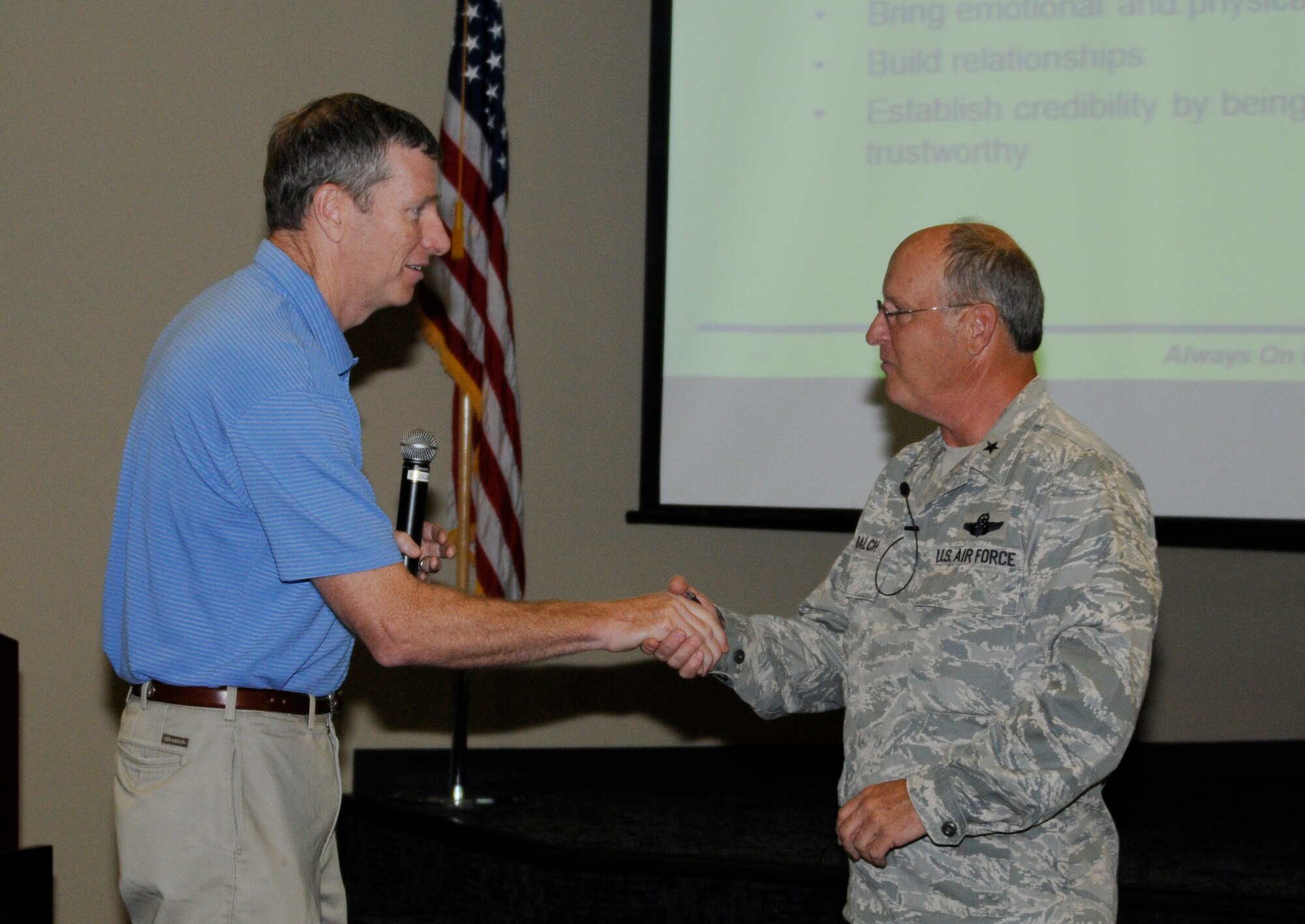 Retired Col. Mark Anderson, former 188th Wing commander, presentes a coin to Brig. Gen. Dwight Balch, commander of the Arkansas Air National Guard, as a token of appreciation at Ebbing Air National Guard Base, Ark., June 5, 2015. Anderson thanked Balch for his leadership and mentorship during his time as the 188th’s commander. Balch will retire June 6, and has served as the Arkansas ANG commander since May 2011. (U.S. Air National Guard photo by Staff Sgt. Hannah Dickerson/Released)