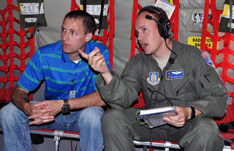 (Left to right) Joe Biggerstaff, AGCO Corporation senior project manager, speaks with his employee, Master Sgt. Michael Stahl, 18th Air Refueling Squadron boom operator, during   a "bosslift" sponsored by the local Employer Support of the Guard and Reserve (ESGR), June 6, 2015.  More than 19 local employers participated in the flight. (U.S. Air Force photo by Capt. Zachary Anderson)