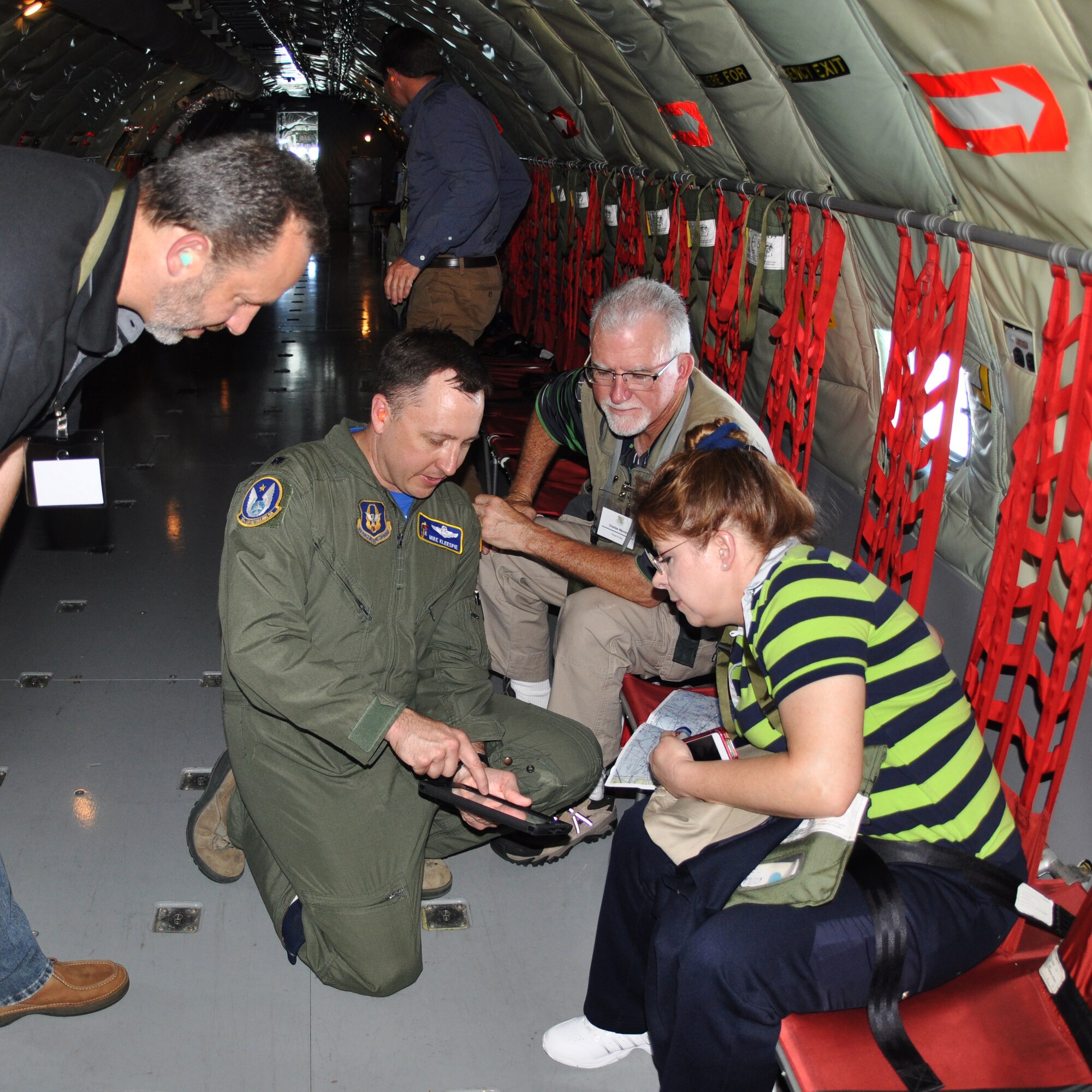 Lt. Col. Michael Kleespie, 18th Air Refueling Squadron pilot, explains the flight path to local employers during a "bosslift" sponsored by the local Employer Support of the Guard and Reserve (ESGR), June 6, 2015.  Nineteen employers of 931st Air Refueling Group Airmen received a first-hand look at how their Reservist employee supports strategic reach.  (U.S. Air Force photo by Tech. Sgt. Abigail Klein)