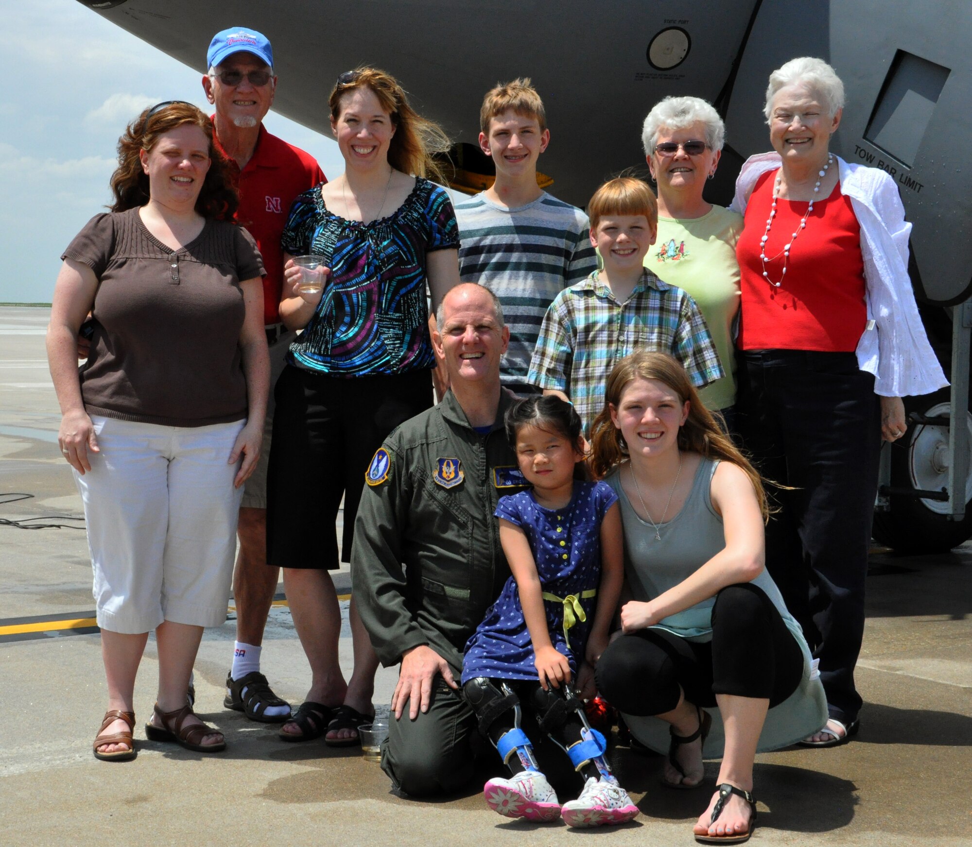 Lt. Col. Eric Vitosh, 18th Air Refueling Squadron Commander, poses with his family on the flightline at McConnell Air Force Base, Kan., after completing "Fini Flight" with the 18 ARS, having flown his final mission as a member of the unit.  Vitosh assumed command of the 18 ARS in May 2012.  He began his enlisted career in 1987 and was accepted into the Air Force Academy in 1988 as part of the Enlisted Airman Development Program. Following his graduation from the Air Force Academy in 1993, he began Air Force Pilot Training and graduated in 1994.  Vitosh served in a variety of capacities during an active duty career that spanned more than a decade. In 2002, he joined the Air Force Reserve as a member of the 18th Air Refueling Squadron at McConnell Air Force Base, Kan. He has served on several deployments to locations in both Europe and Southwest Asia.  (U.S. Air Force photo by Capt. Zach Anderson)
