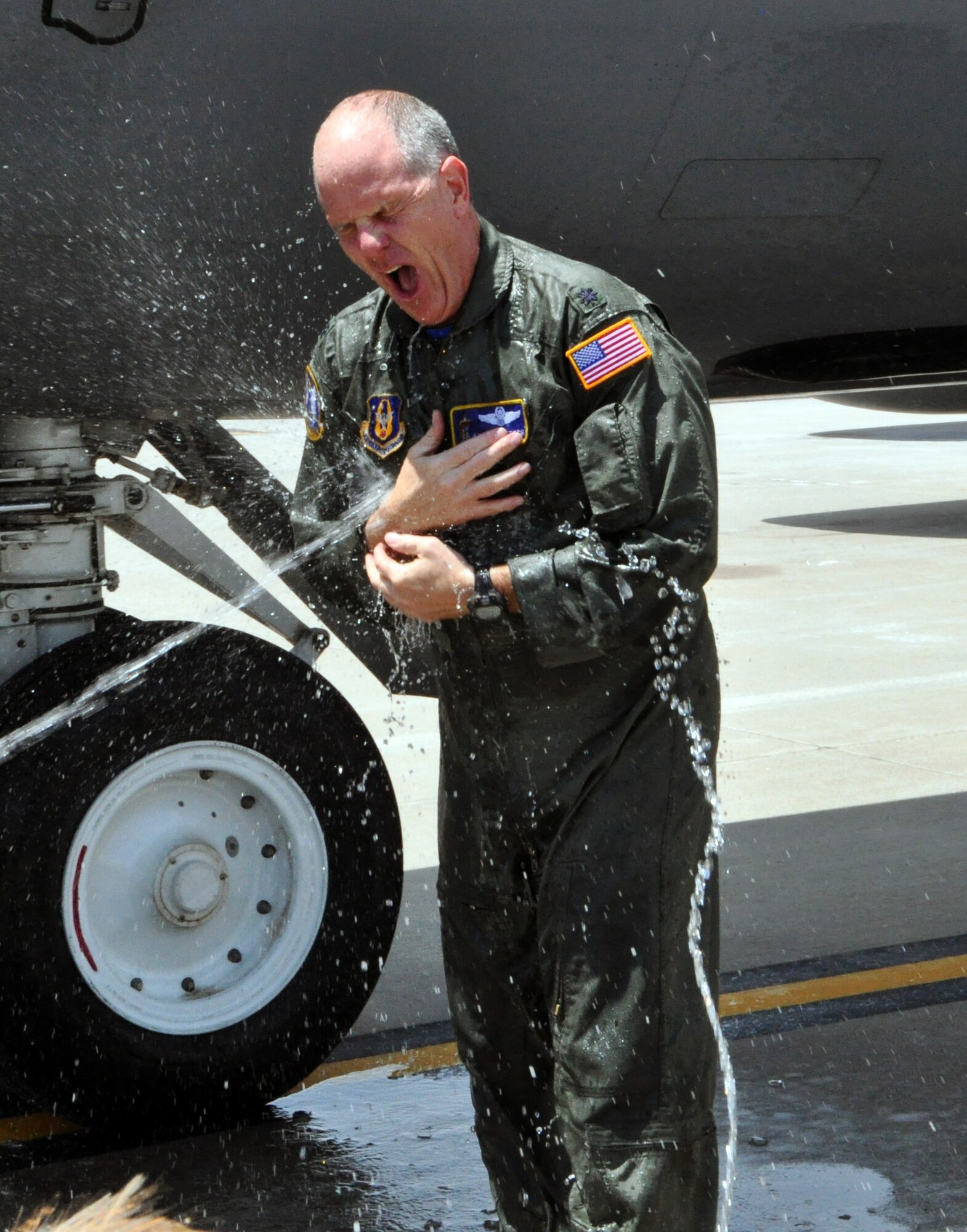 Lt. Col. Eric Vitosh, 18th Air Refueling Squadron Commander, is greeted by a blast of cold water upon exiting a KC-135 Stratotanker at McConnell Air Force Base, Kan., June 6, 2015.  Vitosh had just completed his "Fini Flight" with the 18 ARS, having flown his final mission as a member of the unit.  Vitosh assumed command of the 18 ARS in May 2012.  He began his enlisted career in 1987 and was accepted into the Air Force Academy in 1988 as part of the Enlisted Airman Development Program. Following his graduation from the Air Force Academy in 1993, he began Air Force Pilot Training and graduated in 1994.
Vitosh served in a variety of capacities during an active duty career that spanned more than a decade. In 2002, he joined the Air Force Reserve as a member of the 18th Air Refueling Squadron at McConnell Air Force Base, Kan. He has served on several deployments to locations in both Europe and Southwest Asia.  (U.S. Air Force photo by Capt. Zach Anderson)
