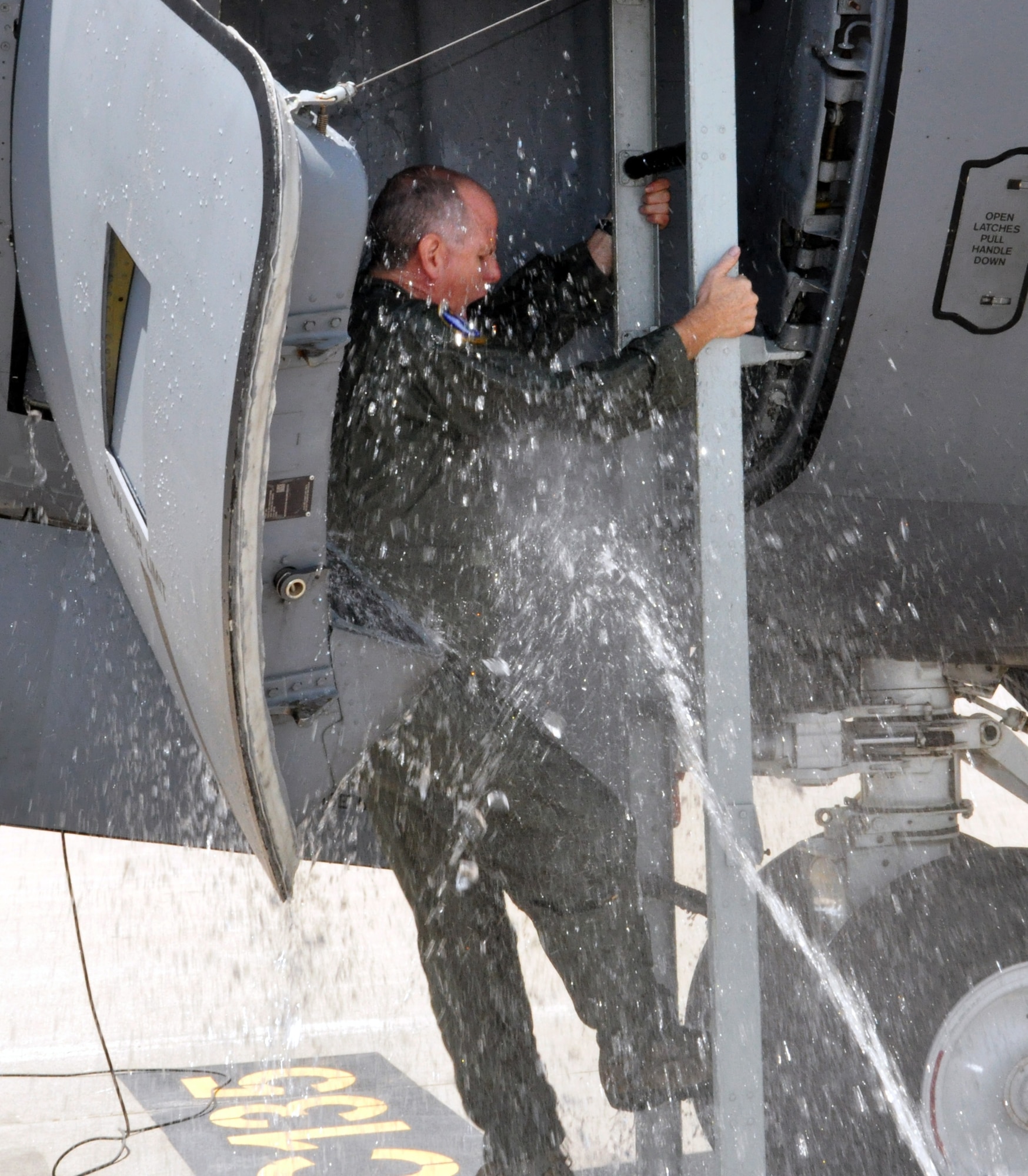 Lt. Col. Eric Vitosh, 18th Air Refueling Squadron Commander, is greeted by a blast of cold water upon exiting a KC-135 Stratotanker at McConnell Air Force Base, Kan., June 6, 2015.  Vitosh had just completed his "Fini Flight" with the 18 ARS, having flown his final mission as a member of the unit.  Vitosh assumed command of the 18 ARS in May 2012.  He began his enlisted career in 1987 and was accepted into the Air Force Academy in 1988 as part of the Enlisted Airman Development Program. Following his graduation from the Air Force Academy in 1993, he began Air Force Pilot Training and graduated in 1994.
Vitosh served in a variety of capacities during an active duty career that spanned more than a decade. In 2002, he joined the Air Force Reserve as a member of the 18th Air Refueling Squadron at McConnell Air Force Base, Kan. He has served on several deployments to locations in both Europe and Southwest Asia.  (U.S. Air Force photo by Capt. Zach Anderson)
