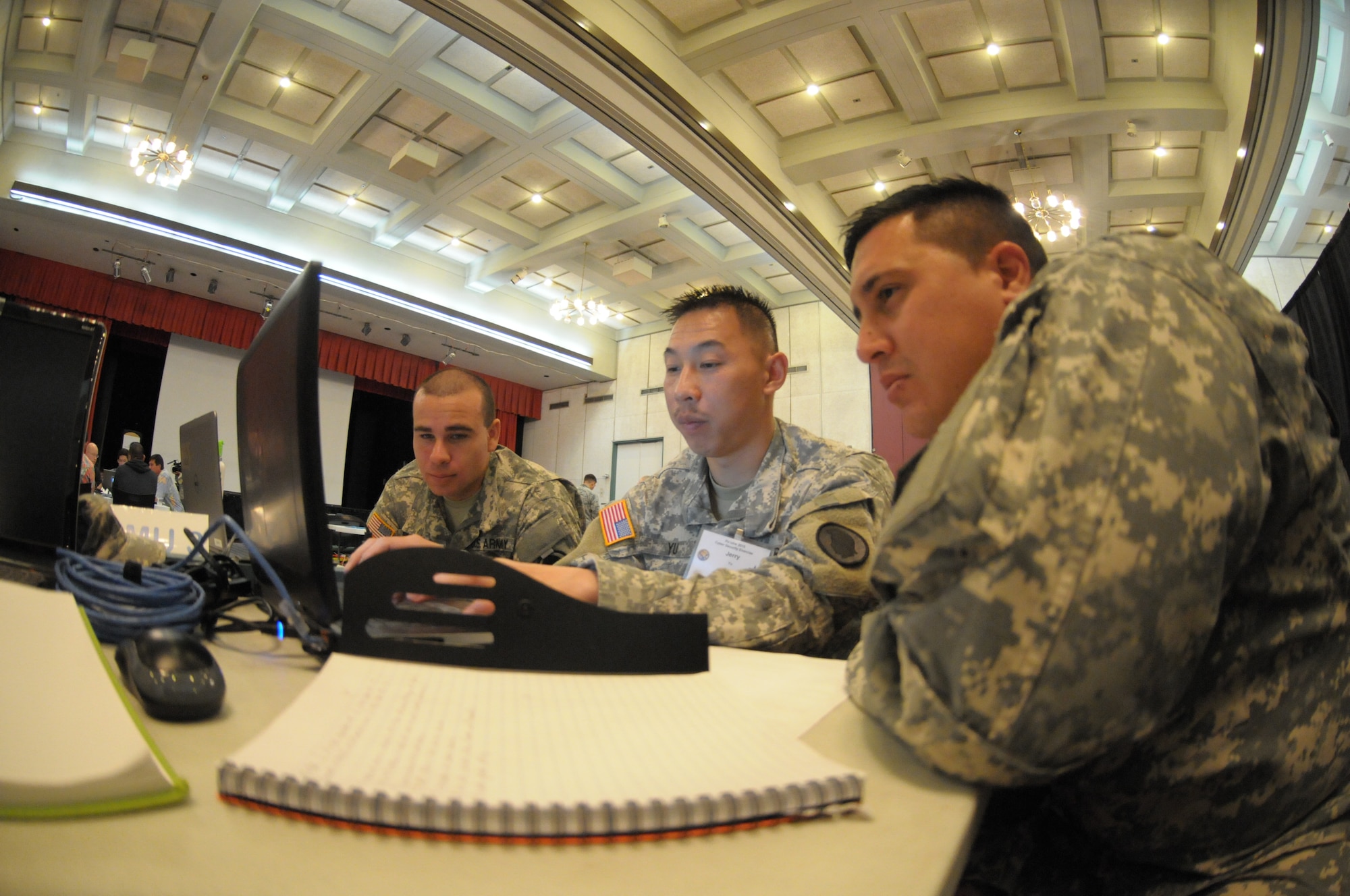 Hawaii Army National Guard soldiers discuss cyber defensive strategies during the Po’oihe 2015 Cyber Security Exercise at the University of Hawaii Manoa Campus Center Ballroom on June 4, 2015. Po’oihe is part of the hurricane preparedness Exercise Vigilant Guard / Makani Pahili 2015 hosted by U.S. Northern Command, National Guard Bureau and the Hawaii Emergency Management Agency. (U.S. Air National Guard photo by Airman 1st Class Robert Cabuco)