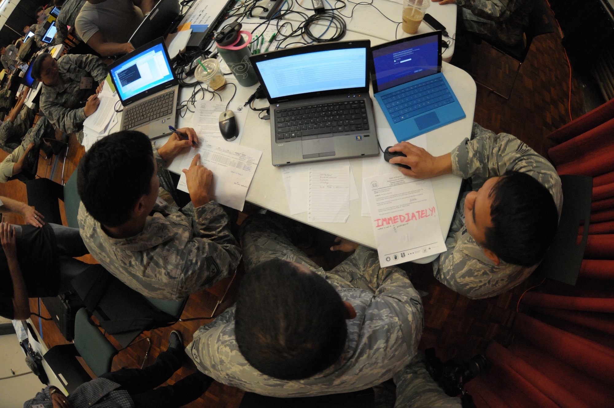 Hawaii Air National Guard airmen evaluate network vulnerabilities during the Po’oihe 2015 Cyber Security Exercise at the University of Hawaii Manoa Campus Center Ballroom on June 4, 2015. Po’oihe is part of the hurricane preparedness Exercise Vigilant Guard / Makani Pahili 2015 hosted by U.S. Northern Command, National Guard Bureau and the Hawaii Emergency Management Agency. (U.S. Air National Guard photo by Airman 1st Class Robert Cabuco)