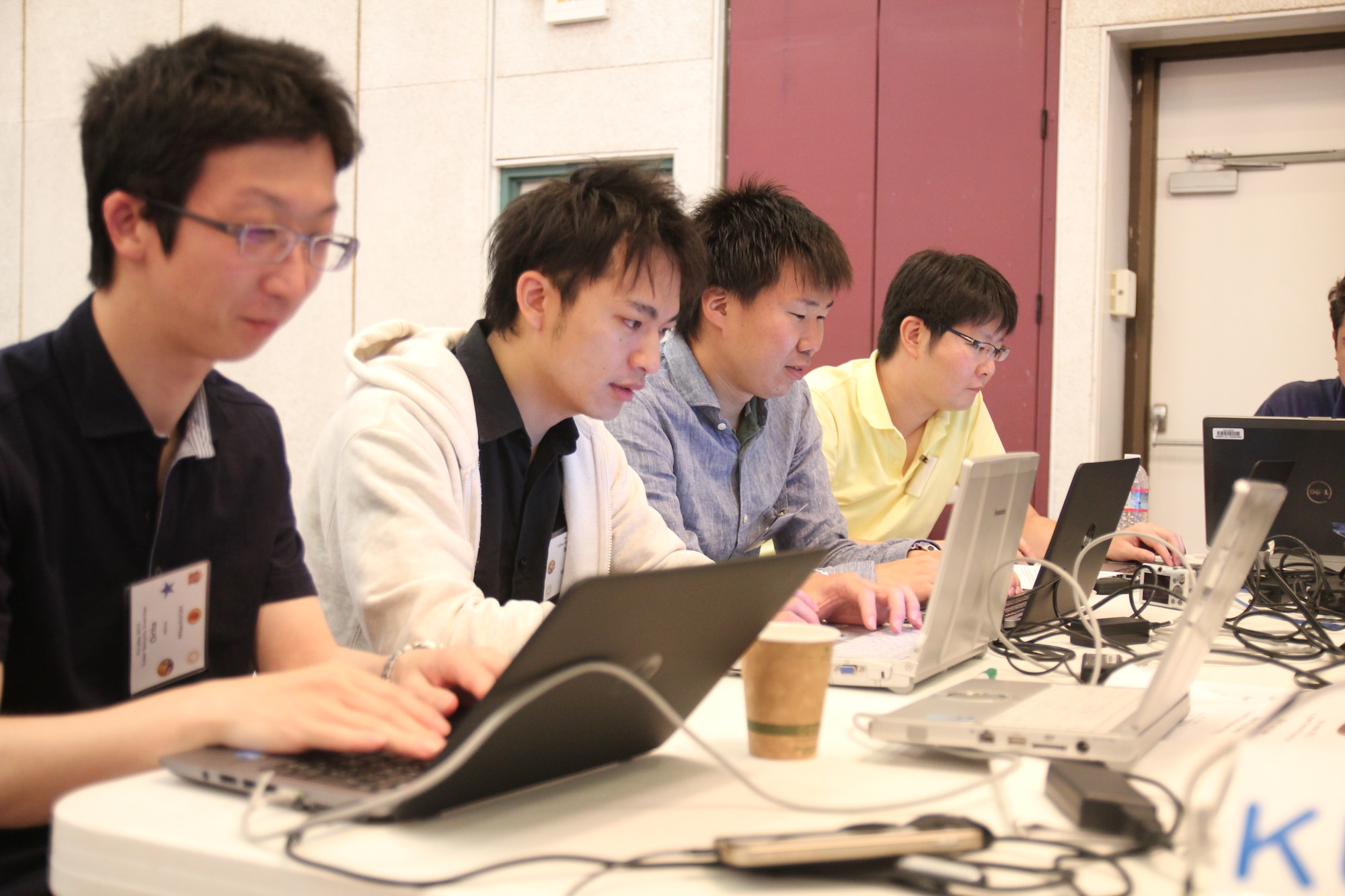 Team members from Hitachi Corporation defend a City Information Portal against cyber attacks during the Po’oihe 2015 Cyber Security Exercise at the University of Hawaii Manoa Campus Center Ballroom on June 4, 2015. This is Team Hitachi’s second year they have travel from Japan to participate in the annual exercise. (U.S. Air National Guard photo by Airman 1st Class Robert Cabuco)