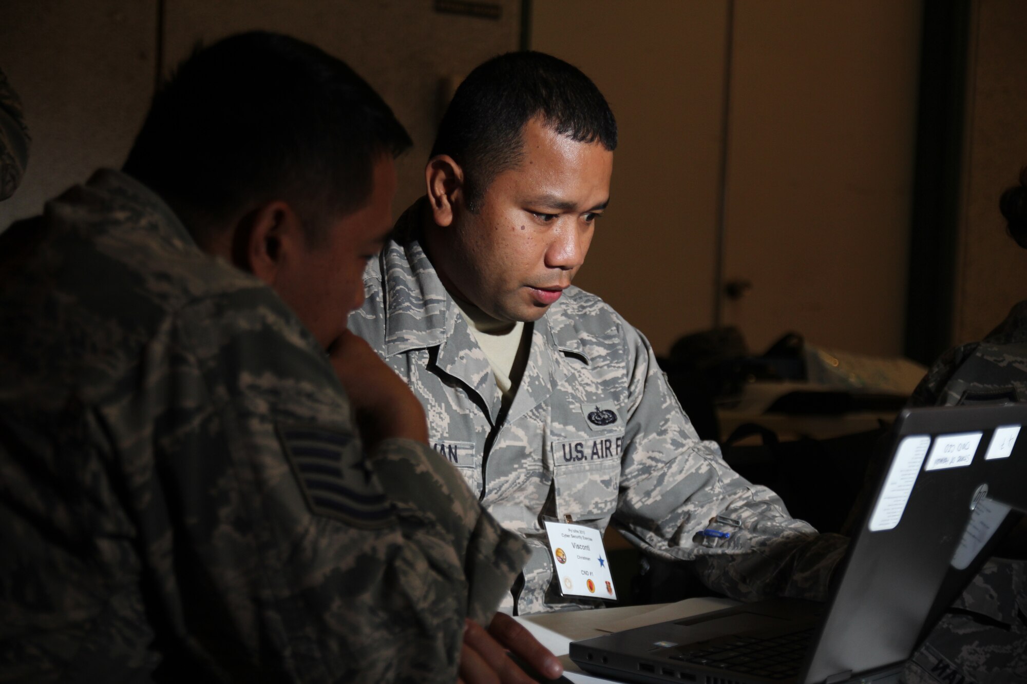 Staff Sgt. Visconti Christman, of the 109 Air Operations Group, Hawaii Air National Guard, defend against cyber attacks during the Po’oihe 2015 Cyber Security Exercise at the University of Hawaii Manoa Campus Center Ballroom on June 4, 2015. This year’s exercise scenario will test the ability of participants to react to a Statewide natural disaster that create opportunities for malicious cyber attacks. (U.S. Air National Guard photo by Airman 1st Class Robert Cabuco)