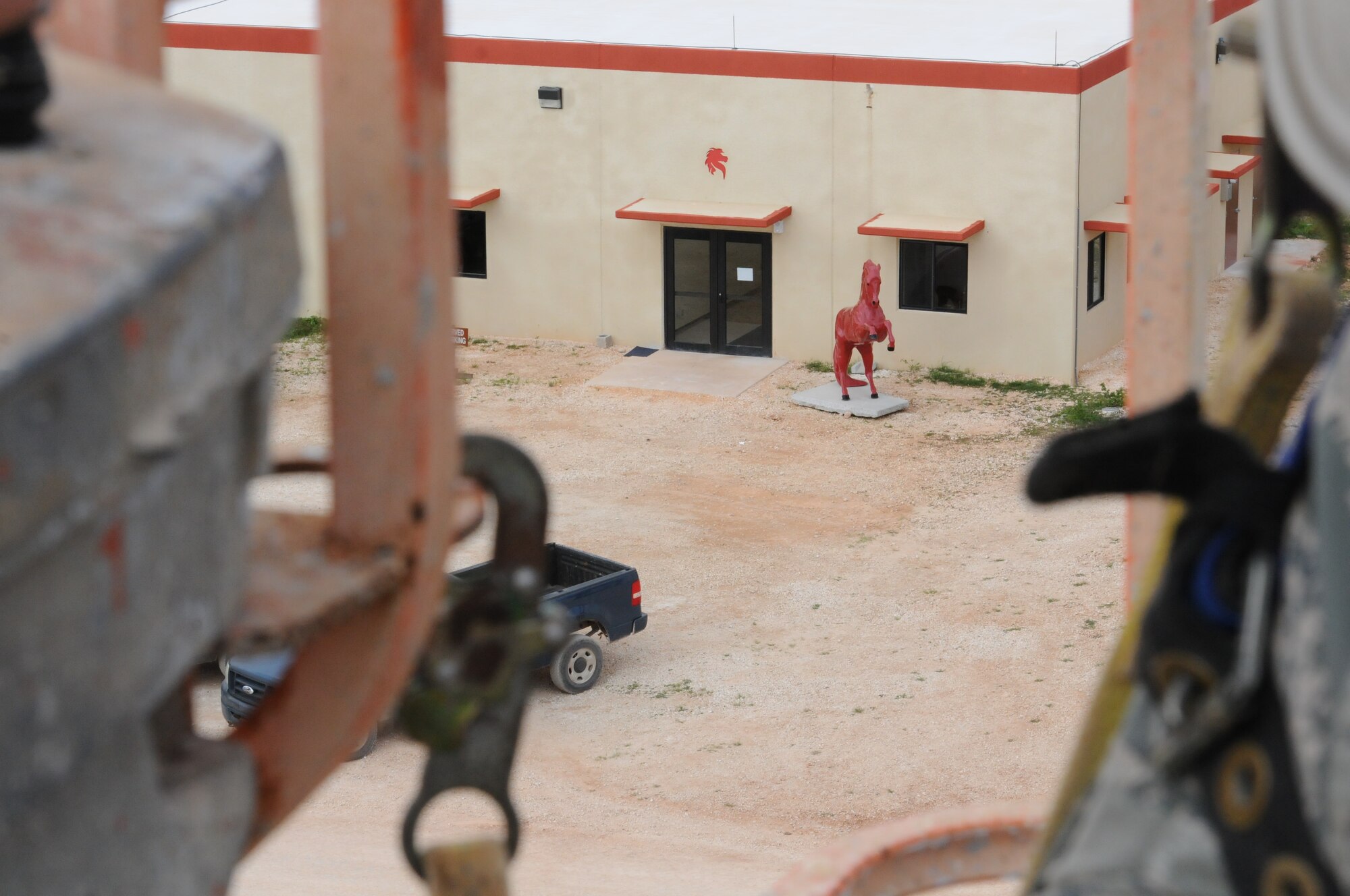 Airmen from the Virginia Air National Guard's Virginia Beach-based 203rd RED HORSE Squadron and the 202nd RHS from Camp Blanding, Florida improve and train upon essential skills June 2, 2015 during a joint-tasking training mission to erect a Facilities Systems Training facility at Anderson Air Force Base, Guam. The FST is a one-story, pre-cast concrete "Tilt-Up Construction" building using troop labor, under the Air National Guard Deployment for Training program. The facility is designed to withstand hurricane-force winds and earthquakes. (U.S. Air National Guard photo by Tech. Sgt. Meghan Skrepenski/Released)