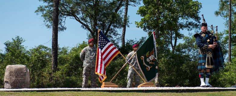 A 7th Special Forces Group Soldier raises the flag during a memorial service for 21 fallen comrades May 21 at Eglin Air Force Base, Fla.  (U.S. Air Force photo/Tech. Sgt. Jasmin Taylor)