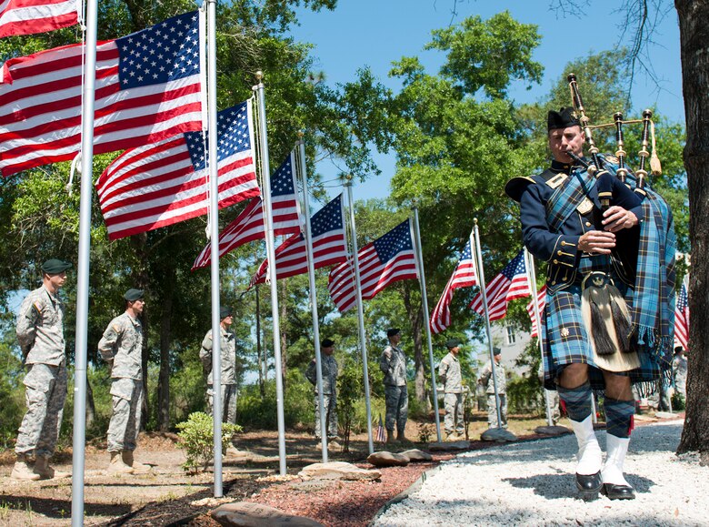 Senior Master Sgt. Steven Bicknell, 919th Maintenance Squadron, plays the bagpipes for the Army’s 7th Special Forces Group memorial service for 21 fallen comrades May 21 at Eglin Air Force Base, Fla.  (U.S. Air Force photo/Tech. Sgt. Jasmin Taylor)