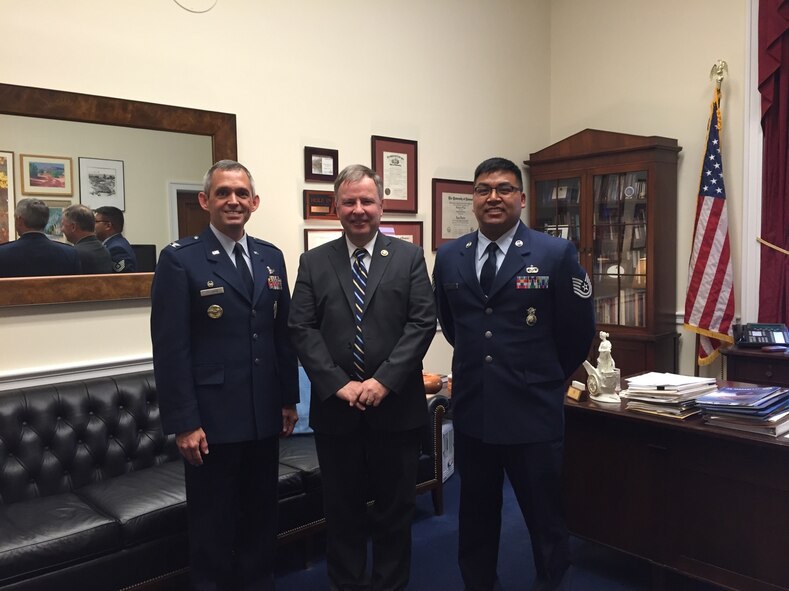 Col. Damon Feltman, 310th Space Wing commander, stands with U.S. Representative Doug Lamborn (R-CO-5), and Tech. Sgt. Joseph Ramos, 710th Security Forces, during a visit to Representative Lamborn’s office in Washington, D.C., June 2, 2015.  Col. Feltman discussed the wing’s mission with Representative Lamborn and highlighted the accomplishments of wing members.  Tech. Sgt. Ramos, the current wing non-commissioned officer of the year, represented the wing’s enlisted members on this year’s visit to the Colorado congressional offices. (Courtesy photo)