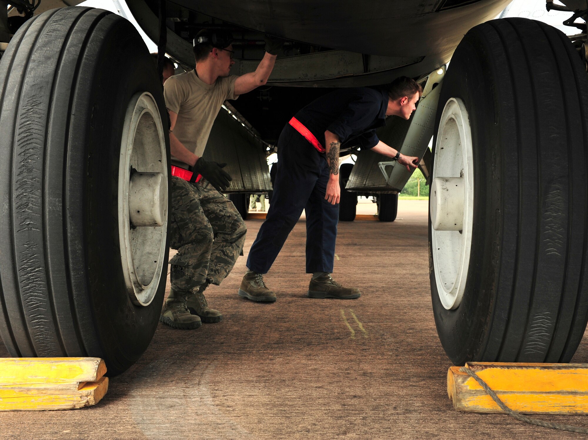 Senior Airman Zachary Silvers and Staff Sgt. Taylor Granger, 5th Aircraft Maintenance Squadron dedicated crew chiefs, check the bomb bay of a B-52H Stratofortress from Minot Air Force Base, N.D., at Royal Air Force Fairford, England, June 5, 2015. Three B-52s, maintenance crews and support teams from bases across Air Force Global Strike Command forward deployed to RAF Fairford to participate in multi-national BALTOPS and Saber Strike exercises. The purpose of BALTOPS 15 is to promote mutual understanding, confidence, cooperation and inoperability among forces and personnel of participating nation. Saber Strike is a long-standing U.S. Army Europe-led cooperative training exercise conducted annually, which aims to improve cooperation and capabilities of participating nations for future contingency operations and train participants on command and control as well as interoperability with regional partners. (U.S. Air Force photos/Senior Airman Malia Jenkins)
