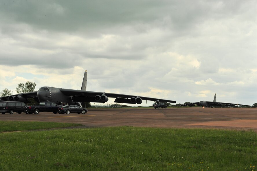 B-52H Stratofortresses from Minot Air Force Base, N.D., sit on the flightline after landing at Royal Air Force Fairford, England, June 5, 2015. Three B-52s, maintenance crews and support teams from bases across Air Force Global Strike Command forward deployed to RAF Fairford to participate in multi-national BALTOPS and Saber Strike exercises. The purpose of BALTOPS 15 is to promote mutual understanding, confidence, cooperation and inoperability among forces and personnel of participating nation. Saber Strike is a long-standing U.S. Army Europe-led cooperative training exercise conducted annually, which aims to improve cooperation and capabilities of participating nations for future contingency operations and train participants on command and control as well as interoperability with regional partners. (U.S. Air Force photos/Senior Airman Malia Jenkins)