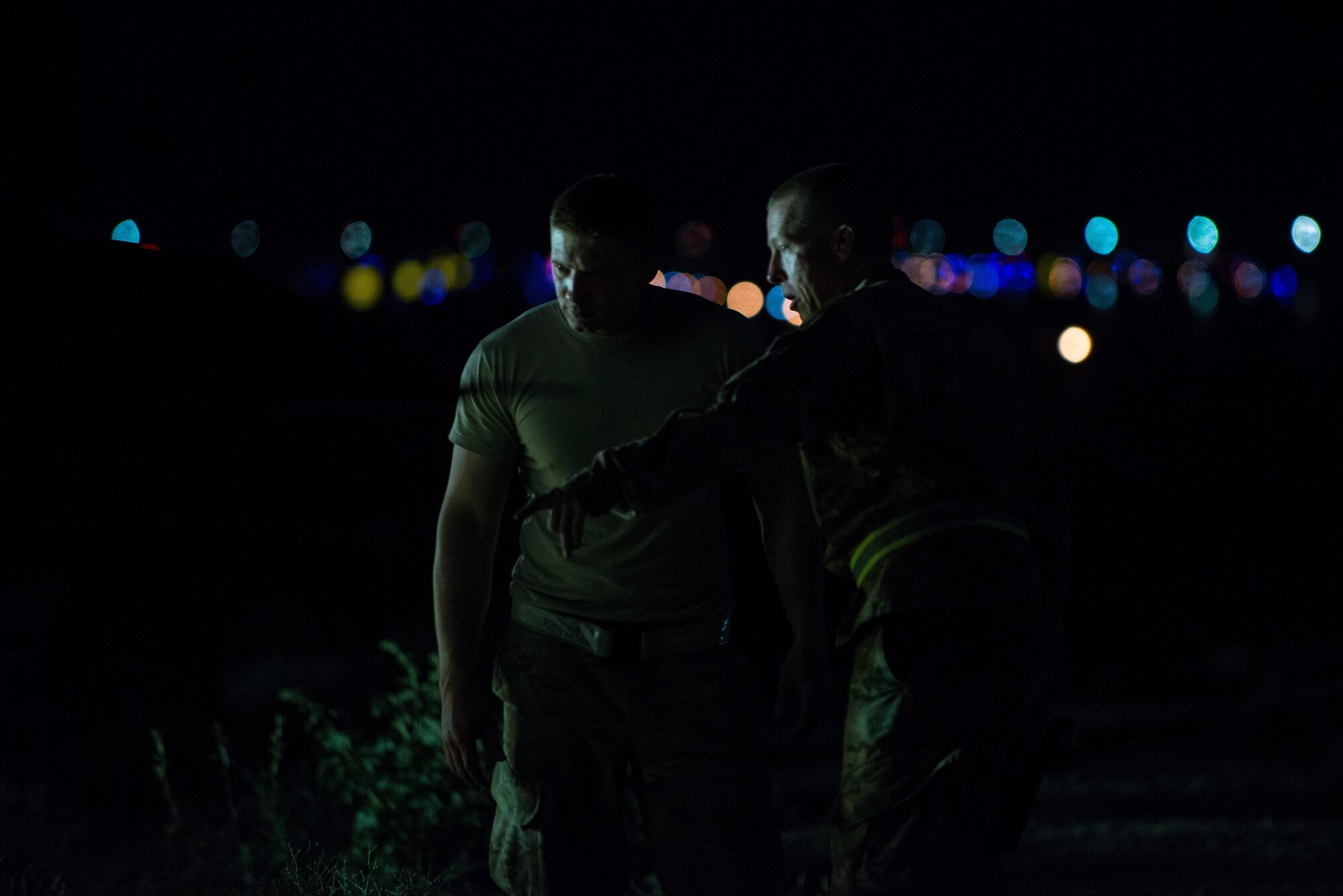 U.S. Air Force Master Sgt. Garrett Faust, 455th Air Expeditionary Wing Crash, Damaged, Disabled Aircraft Recovery (CDDAR) regional manager, explains to an Airman how to best recover an F-16 Fighting Falcon aircraft that departed the runway while landing at Bagram Air Field, Afghanistan, May 4, 2015. The 455th EAMXS maintainers were able to expeditiously recover the aircraft and return the runway to operational status; the pilot was uninjured while the F-16 only sustained minor damage in the mishap.  (U.S. Air Force photo by Tech Sgt. Joseph Swafford/Released)