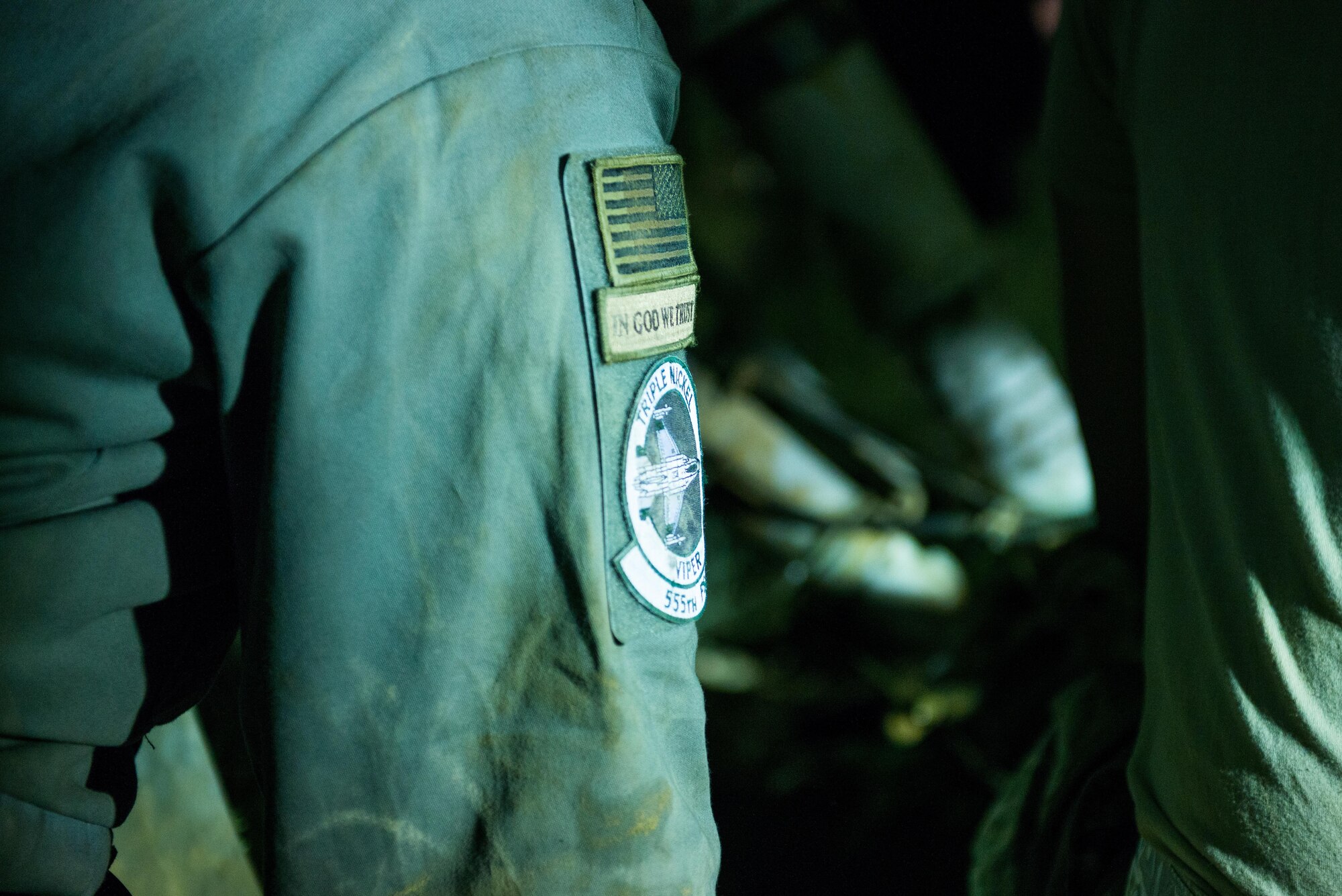 A U.S. Airman assigned to the 455th Expeditionary Aircraft Maintenance Squadron looks on as other 455th EAMXS Airmen work to replace a tire on an F-16 Fighting Falcon aircraft that departed the runway while landing at Bagram Air Field, Afghanistan, May 4, 2015. The 455th EAMXS maintainers were able to expeditiously recover the aircraft and return the runway to operational status; the pilot was uninjured while the F-16 only sustained minor damage in the mishap. (U.S. Air Force photo by Tech Sgt. Joseph Swafford/Released)