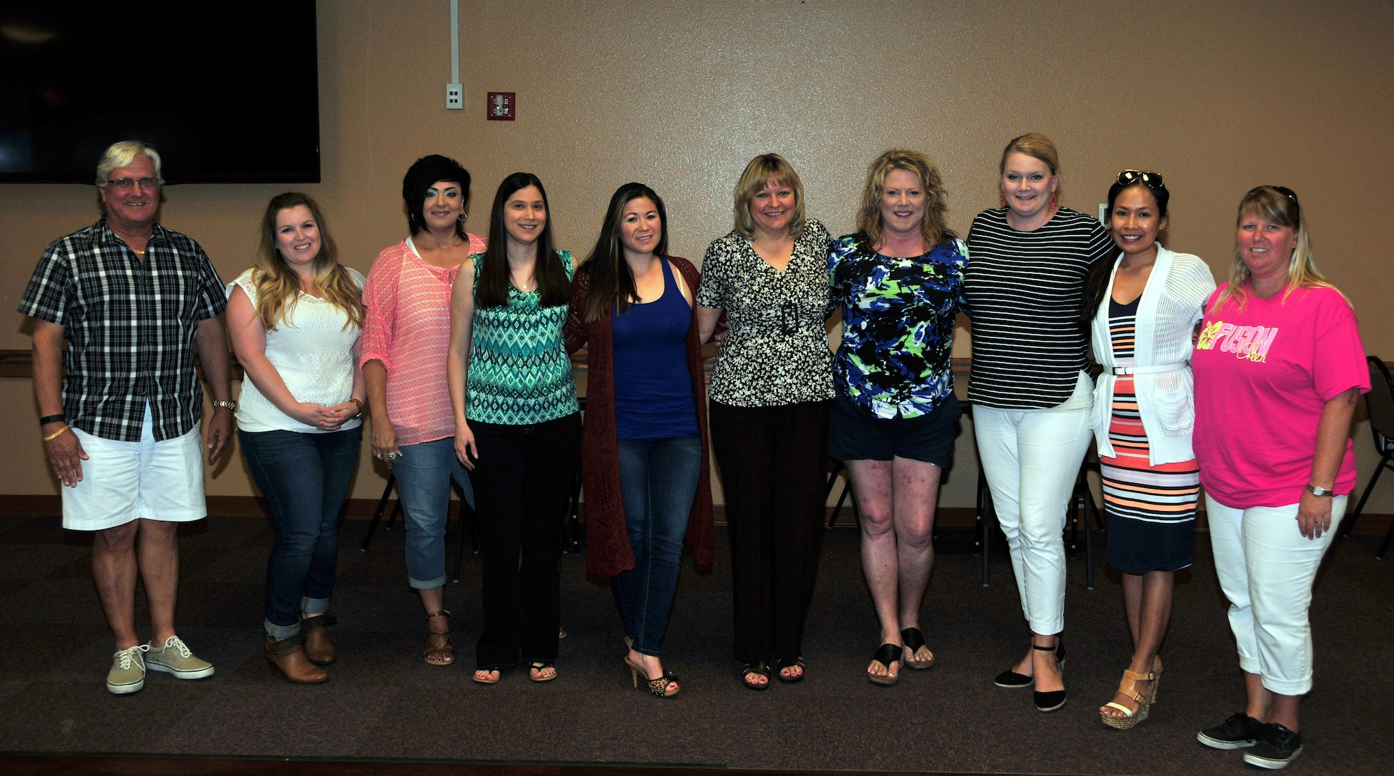 Members of the key spouse program gather for a group photo during a recent meeting at the 161st Air Refueling Wing, Phoenix, June 7. The key spouse program is an official family program designed to enhance readiness, establish a sense of unity within the Air Force community and to address the needs of military families. (U.S. Air National Guard photo by Tech. Sgt. Michael Matkin)