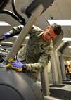 Tech. Sgt. Eli Dunbar, 919th Special Operations Medical Squadron, wipes down equipment during the G. I. party June 7 at Duke Field, Fla. A group of Airmen from the 919th SOMDS came together to clean the fitness center during the June unit training assembly. (U.S. Air Force photo/ Tech. Sgt. Cheryl L. Foster)