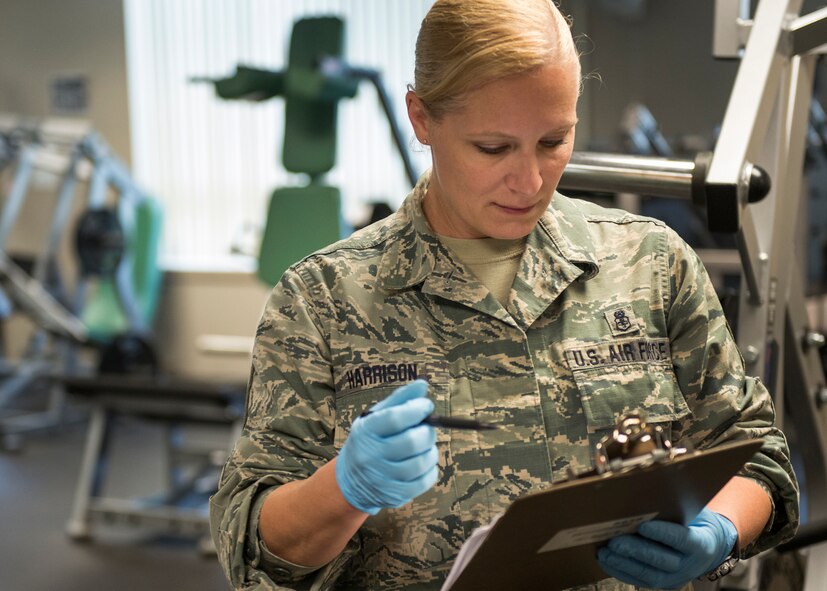 Master Sgt. Donna Harrison, 919th Special Operations Medical Squadron, marks off items on the checklist during the G. I. party June 7 at Duke Field, Fla. A group of Airmen from the 919th SOMDS came together to clean the fitness center during the June unit training assembly. (U.S. Air Force photo/ Tech. Sgt. Cheryl L. Foster)