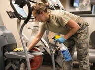 Staff Sgt. Candice Winn, 919th Special Operations Medical Squadron, wipes down equipment during the G. I. party June 7 at Duke Field, Fla. A group of Airmen from the 919th SOMDS came together to clean the fitness center during the June unit training assembly. (U.S. Air Force photo/ Tech. Sgt. Cheryl L. Foster)