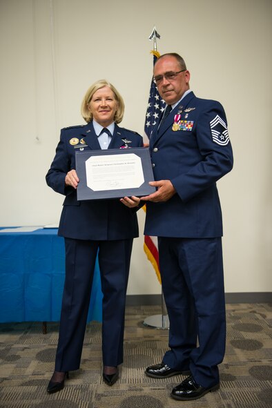 Chief Master Sgt. Christopher H. Knowles, 934th Aeromedical Evacuation Squadron, retires from service at the Minneapolis-St. Paul Air Reserve Station, Minn. Friends, family and fellow Airmen came to help celebrate Chief Knowles 30 year career with the United States Air Force. (U.S. Air Force photo by Staff Sgt. Corban Lundborg/Released) 