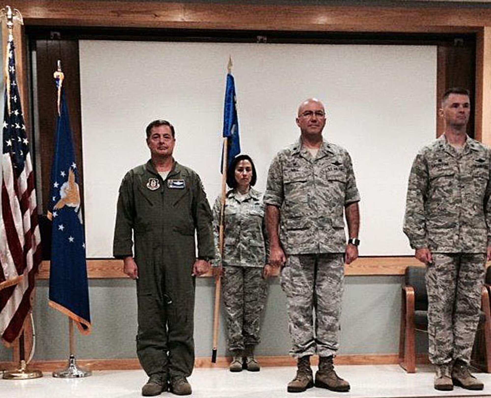 Col. MarK Blalock, 920th Operations Group Commander (left), officiates the 920th Operational Support Squadron change of command where Lt. Col. Timothy Davis (middle) relinquished command to Lt. Col. Chris Lacouture (right) June 6, 2015. 