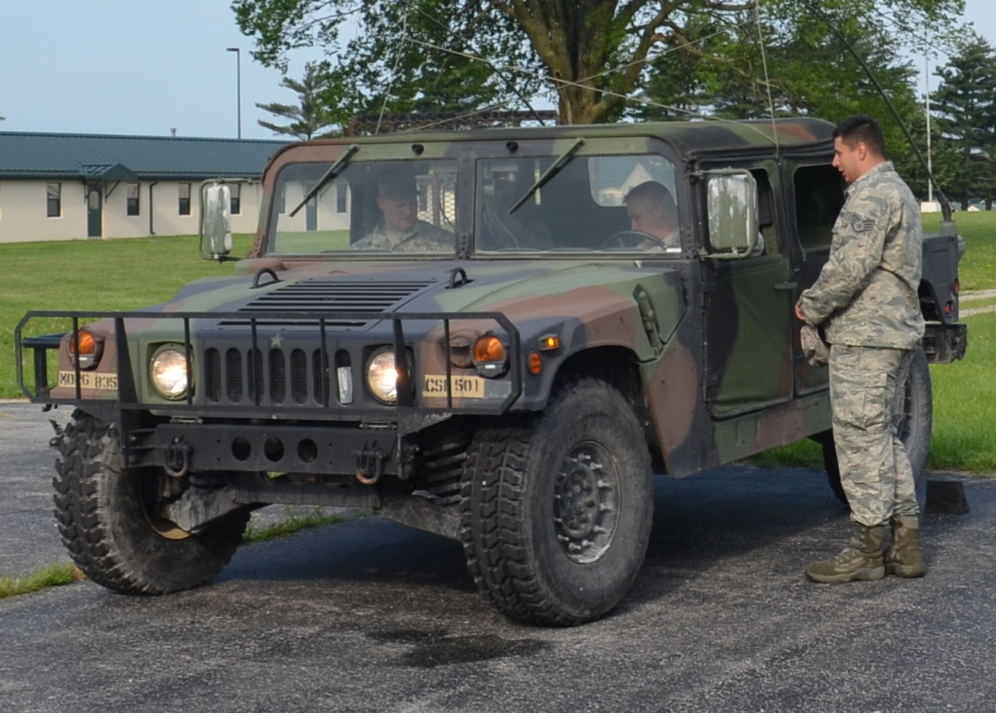 Citizen-Airmen from the 131st Bomb Wing familiarize themselves with a Humvee in preparation for convoy operations training at Camp Clark, near Nevada, Missouri, June 3, 2015.  The Airmen were training as part of a state emergency duty exercise.  (U.S. Air National Guard photo by 2nd Lt. Justin Clark)