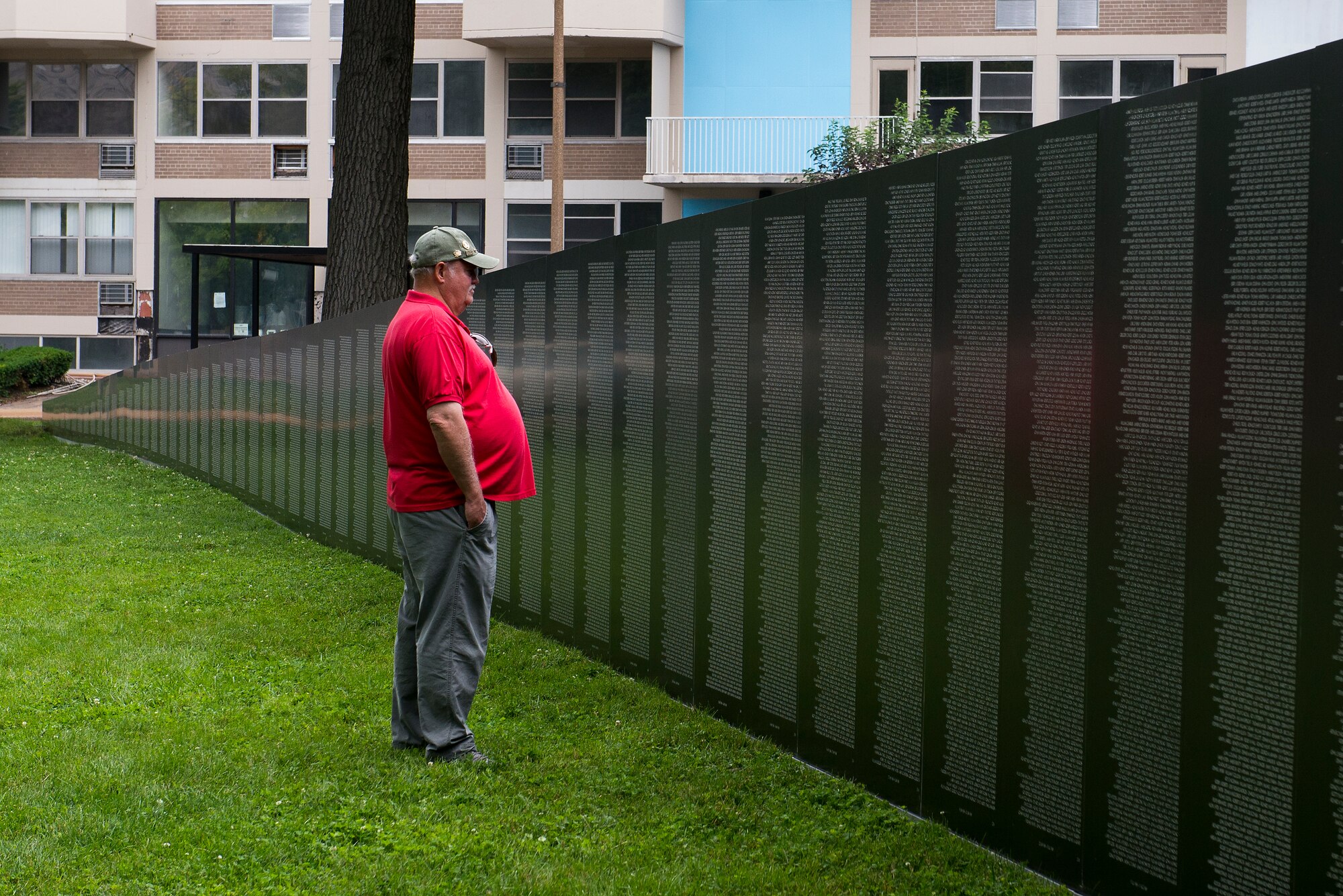 A Vietnam veteran looks at Traveling Vietnam Wall at the Eternal Flame Park, St. Louis, Missouri, June 4, 2015. The Traveling Vietnam Wall is a tribute dedicated to the memory of the servicemembers who lost their lives in the Vietnam War. (U.S. Air Force Photo by Airman 1st Class Megan Friedl)
