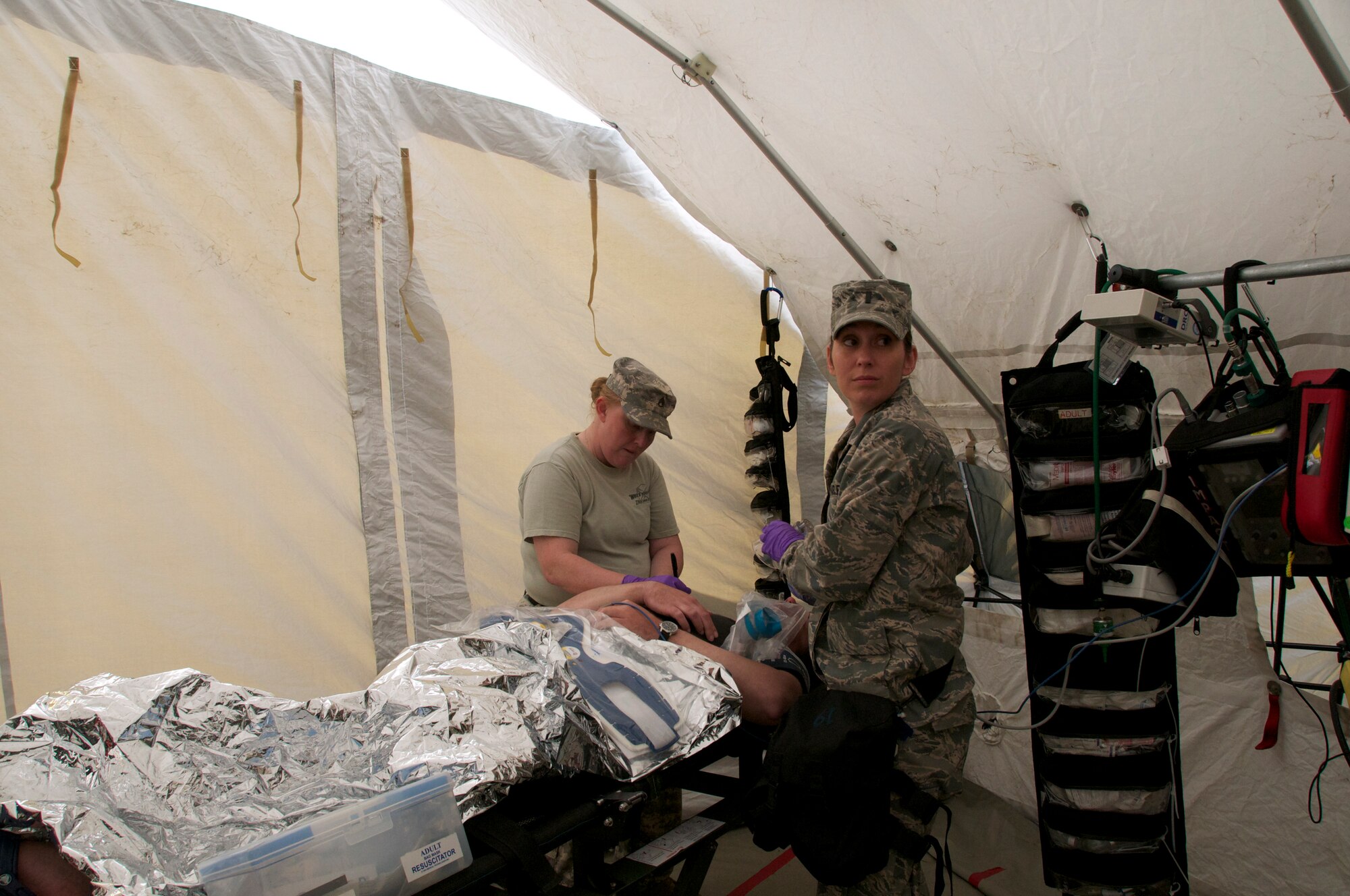 More than 45 airmen assigned to the Virginia Army and Air National Guard participated a six-day external evaluation involving scenarios that tested their Chemical, Biological, Radiological, Nuclear, and Explosive (CBRNE) Enhanced Response Force Package (CERFP) skills, May 11-16 at the Virginia Beach Fire and EMS Training Center in Virginia Beach, Virginia.  Members from the 192nd Fighter Wing Medical Group were required to perform medical triage by taking patients out of decontamination and examining them to determine how they should be medically treated. (U.S. Air National Guard photo by Master Sgt. Carlos J. Claudio/Released)
