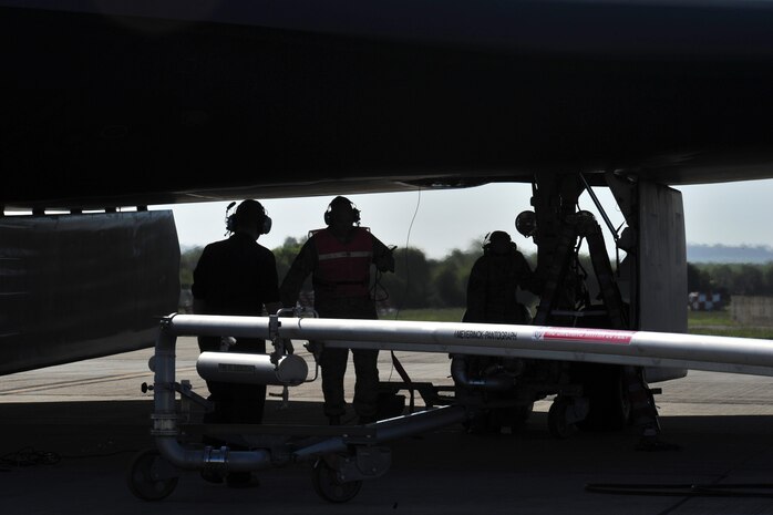 509th Aircraft Maintenance Squadron crew chiefs prepare to move a pantograph fuel pipe into position to refuel a B-2 Spirit at Royal Air Force Fairford, England, June 7, 2015. This event also showcased the alliance between active duty and Air National Guard Airmen from the 131st Bomb Wing at Whiteman Air Force Base, MO, who coordinated the B-2’s presence in the European area of responsibility. (U.S. Air Force photo/Senior Airman Malia Jenkins)