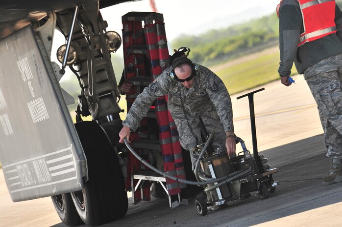 A 509th Aircraft Maintenance Squadron crew chief preps a B-2 Spirit for refueling at Royal Air Force Fairford, England, June 7, 2015. A hot-pit refueling was conducted after the B-2 Spirit landed on RAF Fairford, England, showcasing the capability of the aircraft to forward deploy and deliver a conventional and nuclear force anytime and anywhere. (U.S. Air Force photo/Senior Airman Malia Jenkins)