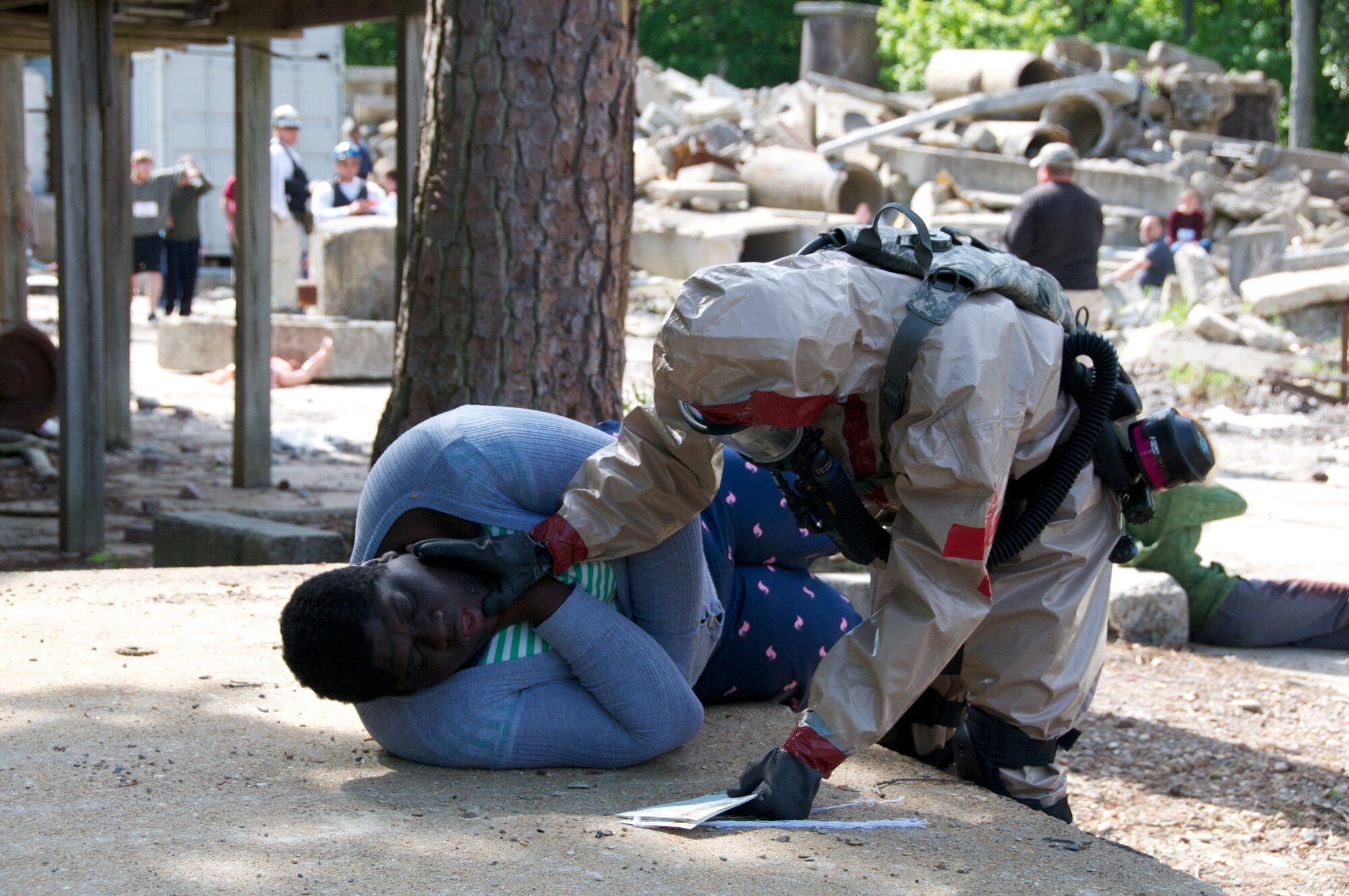 More than 45 airmen assigned to the Virginia Army and Air National Guard participated a six-day external evaluation involving scenarios that tested their Chemical, Biological, Radiological, Nuclear, and Explosive (CBRNE) Enhanced Response Force Package (CERFP) skills, May 11-16 at the Virginia Beach Fire and EMS Training Center in Virginia Beach, Virginia.  Members from the 192nd Fighter Wing Medical Group were required to perform medical triage by taking patients out of decontamination and examining them to determine how they should be medically treated. (U.S. Air National Guard photo by Master Sgt. Carlos J. Claudio/Released)
