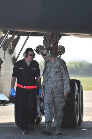 509th Aircraft Maintenance Squadron crew chiefs discuss refueling a B-2 Spirit at Royal Air Force Fairford, England, June 7, 2015. This event also showcased the alliance between active duty and Air National Guard Airmen from the 131st Bomb Wing at Whiteman Air Force Base, MO, who coordinated the B-2’s presence in the European area of responsibility. (U.S. Air Force photo/Senior Airman Malia Jenkins)