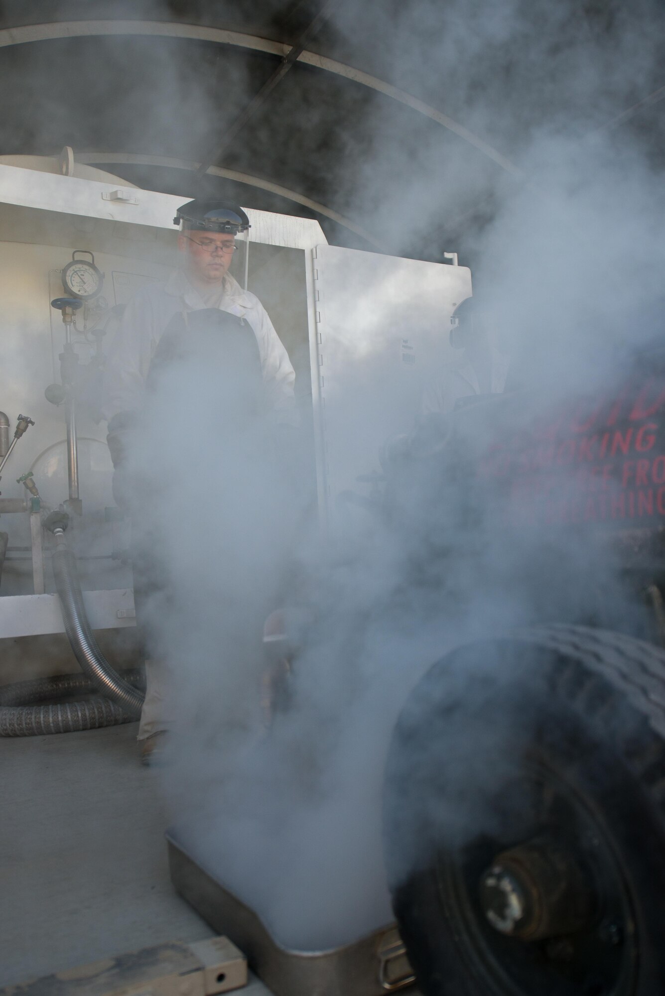 U.S. Air Force Staff Sgt. Mykel Wilson, 455th Expeditionary Logistics Readiness Squadron cryogenics shop noncommissioned officer in charge deployed from Kadena Air Base, Japan, fills 50-gallon liquid oxygen (LOX) carts at Bagram Air Field, Afghanistan, May 16, 2015. The cryogenics shop is responsible for supplying, storing and making sure the LOX used at Bagram meets Air Force standards. (U.S. Air Force photo by Tech. Sgt. Joseph Swafford/Released)