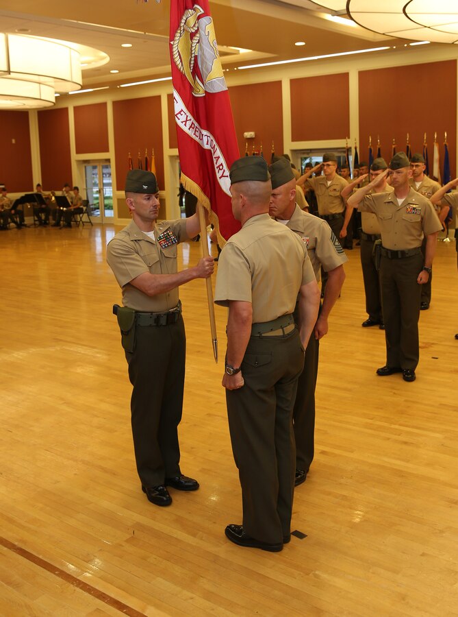 U.S. Marine Corps Col. Todd Simmons, 22nd Marine Expeditionary Unit (MEU) commanding officer receives the Unit Battle Colors during a change of command ceremony at Marine Corps Base Camp Lejeune, N.C., June 5, 2015. Simmons succeeds U.S. Marine Corps Col. William Dunn as MEU commanding officer. (U.S. Marine Corps photo by Cpl. Caleb McDonald)