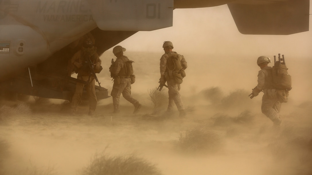 Marines and Sailors with India Company, 3rd Battalion, 7th Marine Regiment, Special Purpose Marine Air Ground Task Force – Crisis Response – Central Command, escort a simulated isolated person onto an MV-22 Osprey during a tactical recovery of aircraft and personnel training exercise, May 29, 2015, in Southwest Asia. With U.S. and coalition forces conducting airstrikes in support of Operation Inherent Resolve, the TRAP forces of the SPMAGTF provide an on-call force dedicated to the safe return of the U.S. and coalition service members. (U.S. Marine Corps Photo by Cpl. Garrett D. White, CJTF-OIR Public Affairs)