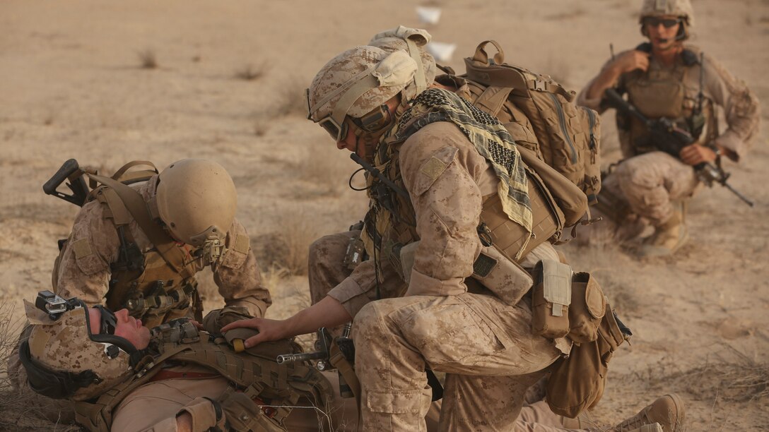 Marines and Sailors with India Company, 3rd Battalion, 7th Marine Regiment, Special Purpose Marine Air Ground Task Force – Crisis Response – Central Command, assess the condition of a simulated casualty during a tactical recovery of aircraft and personnel training exercise, May 29, 2015, in Southwest Asia. With U.S. and coalition forces conducting airstrikes in support of Operation Inherent Resolve, the TRAP forces of the SPMAGTF provide an on-call force dedicated to the safe return of the U.S. and coalition service members. (U.S. Marine Corps Photo by Cpl. Garrett D. White, CJTF-OIR Public Affairs,)